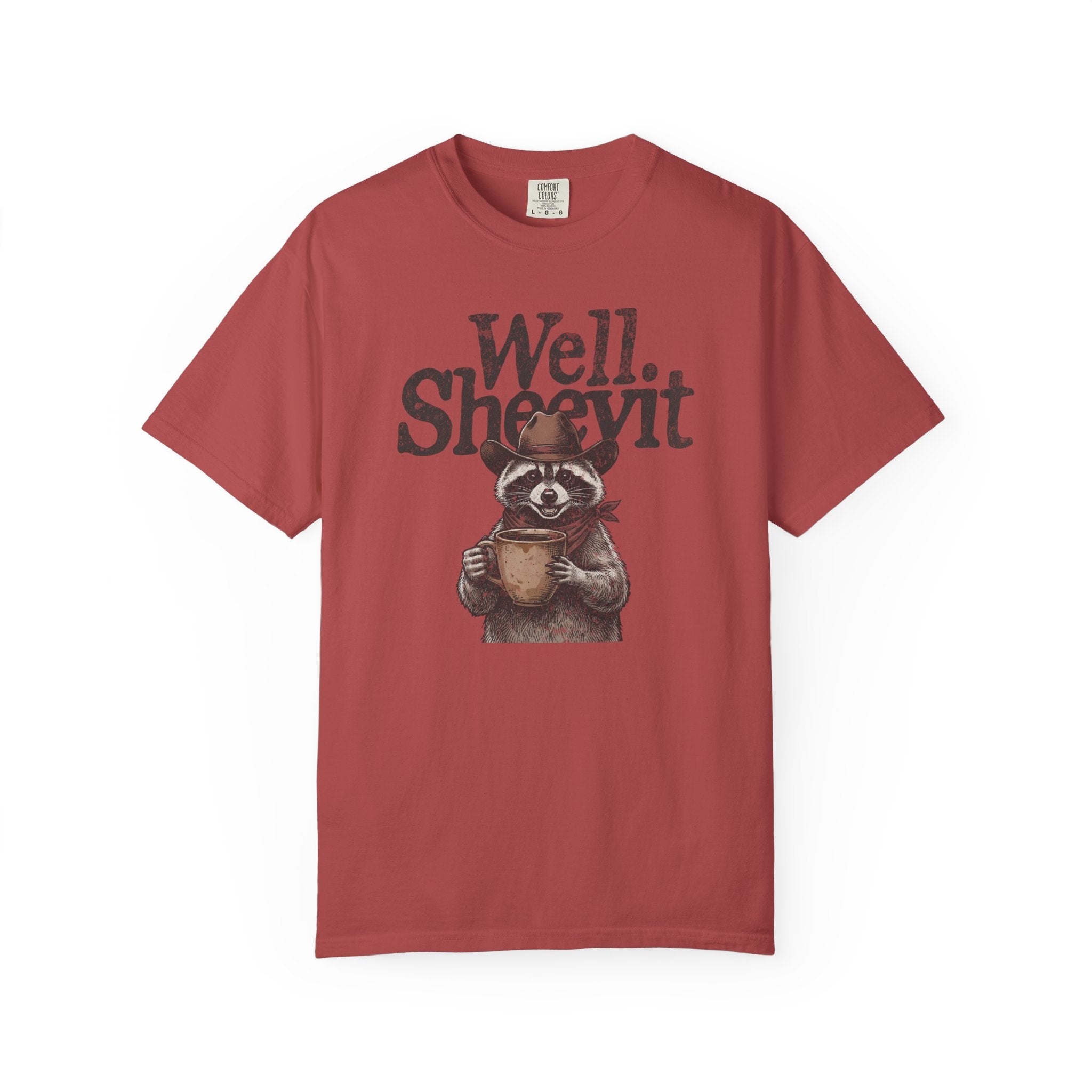 Red t-shirt featuring a graphic of a raccoon wearing a cowboy hat and holding a coffee mug.