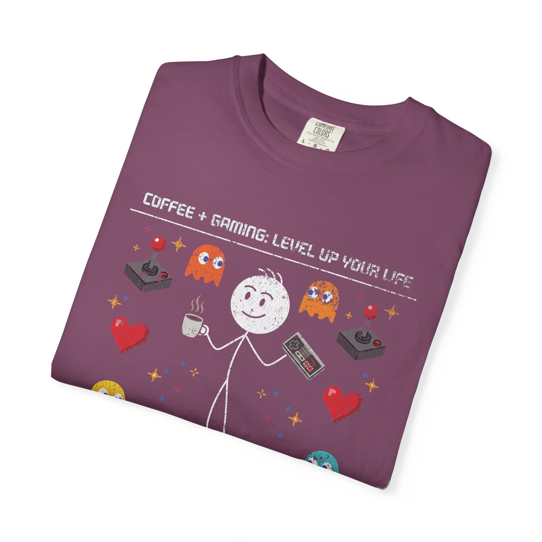 A purple unisex t-shirt featuring a distressed graphic of a stick figure with coffee and a controller
