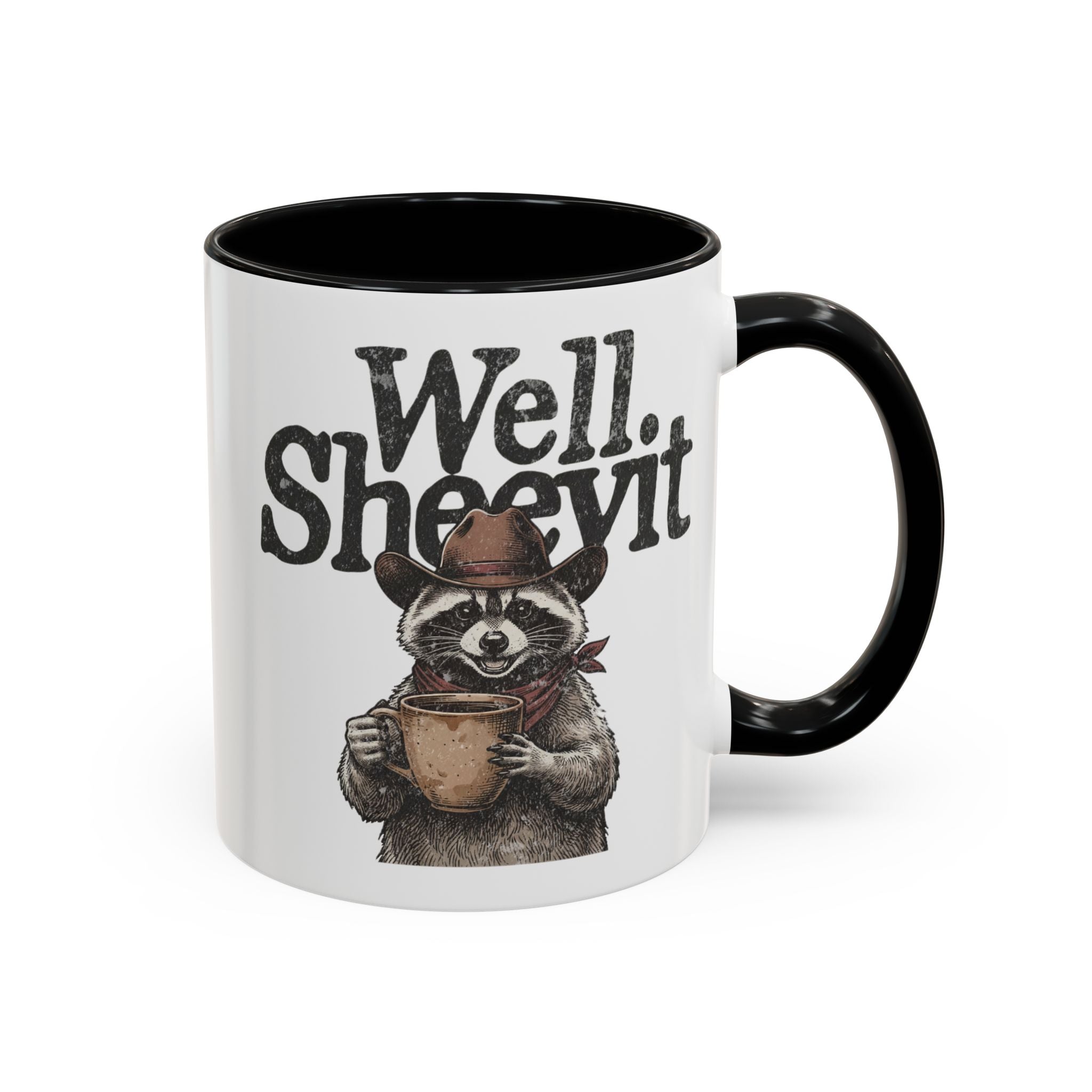 White ceramic mug with a black handle and rim, featuring a raccoon wearing a cowboy hat.