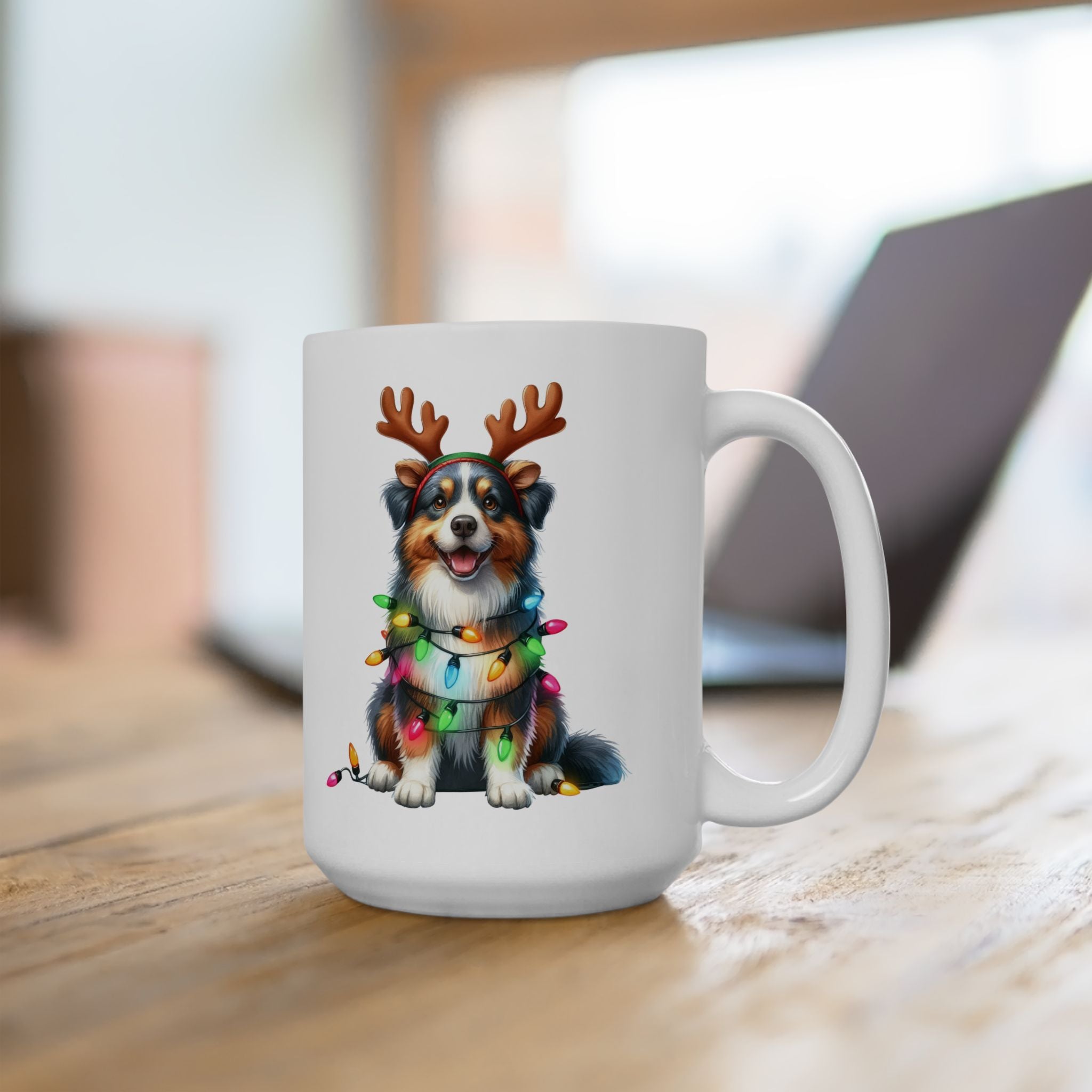 White ceramic mug with an Australian Shepherd wearing reindeer antlers and Christmas lights.