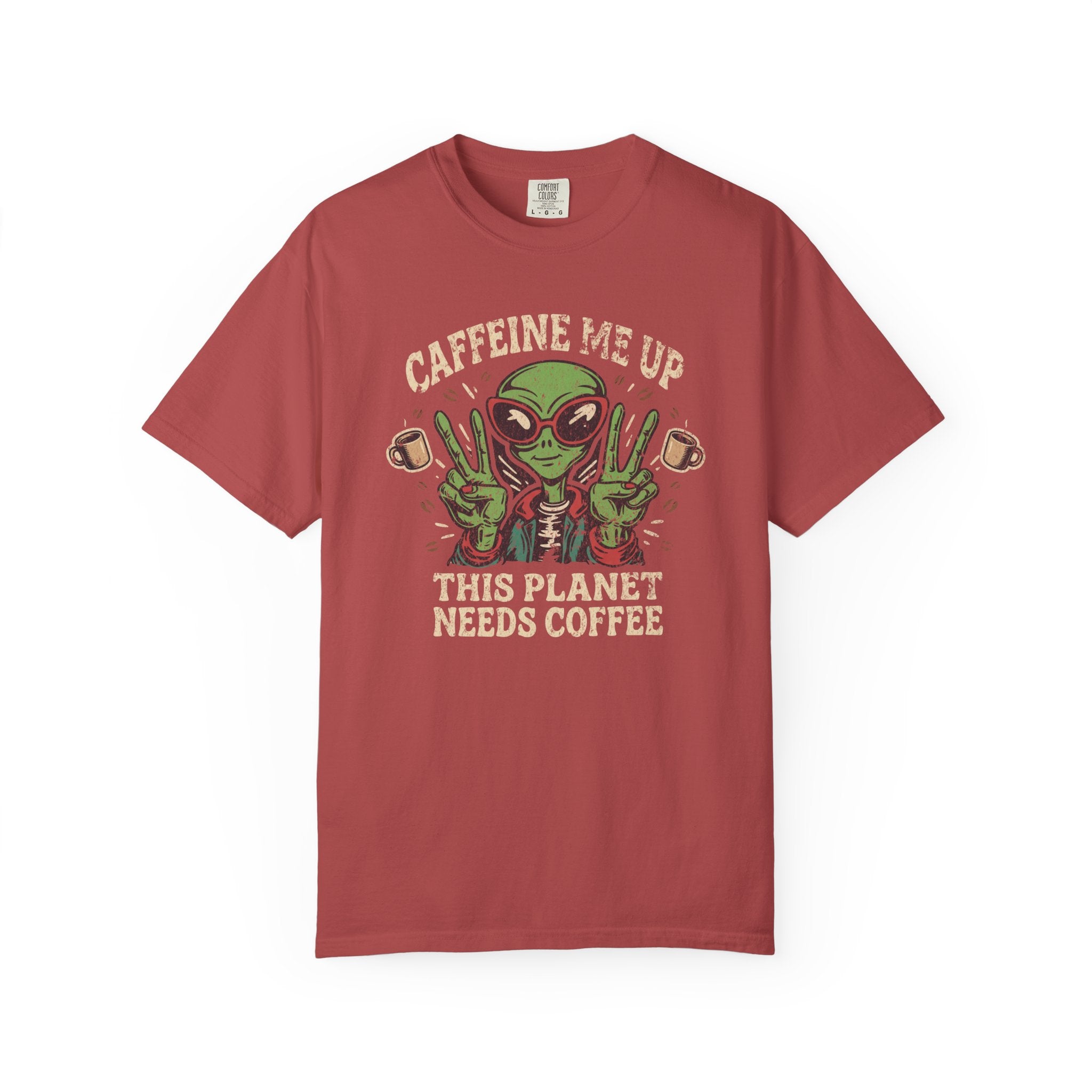 Red unisex cotton t-shirt featuring a distressed alien graphic with coffee and text.