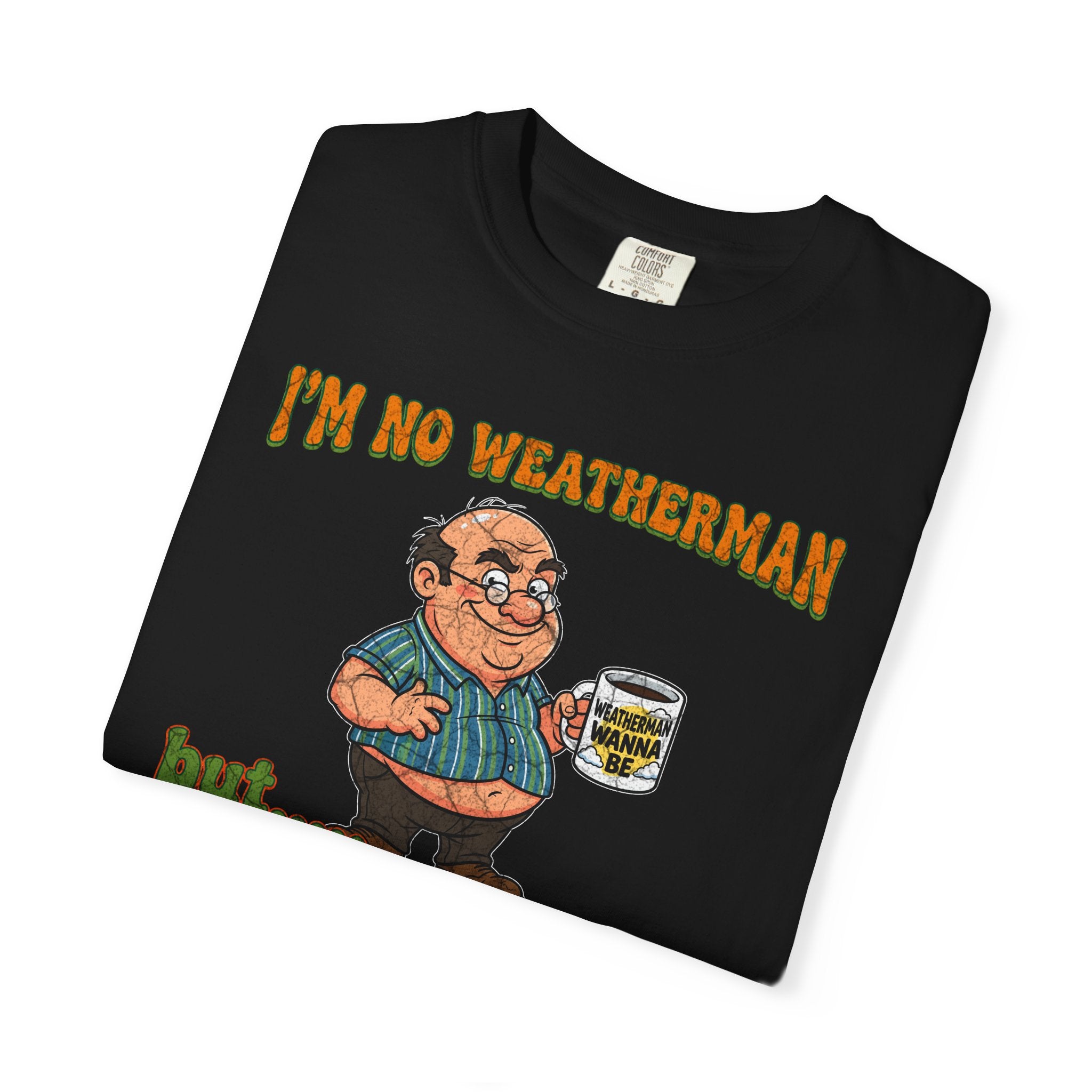 Black t-shirt featuring a cartoon man holding a mug that says Weatherman Wanna Be.