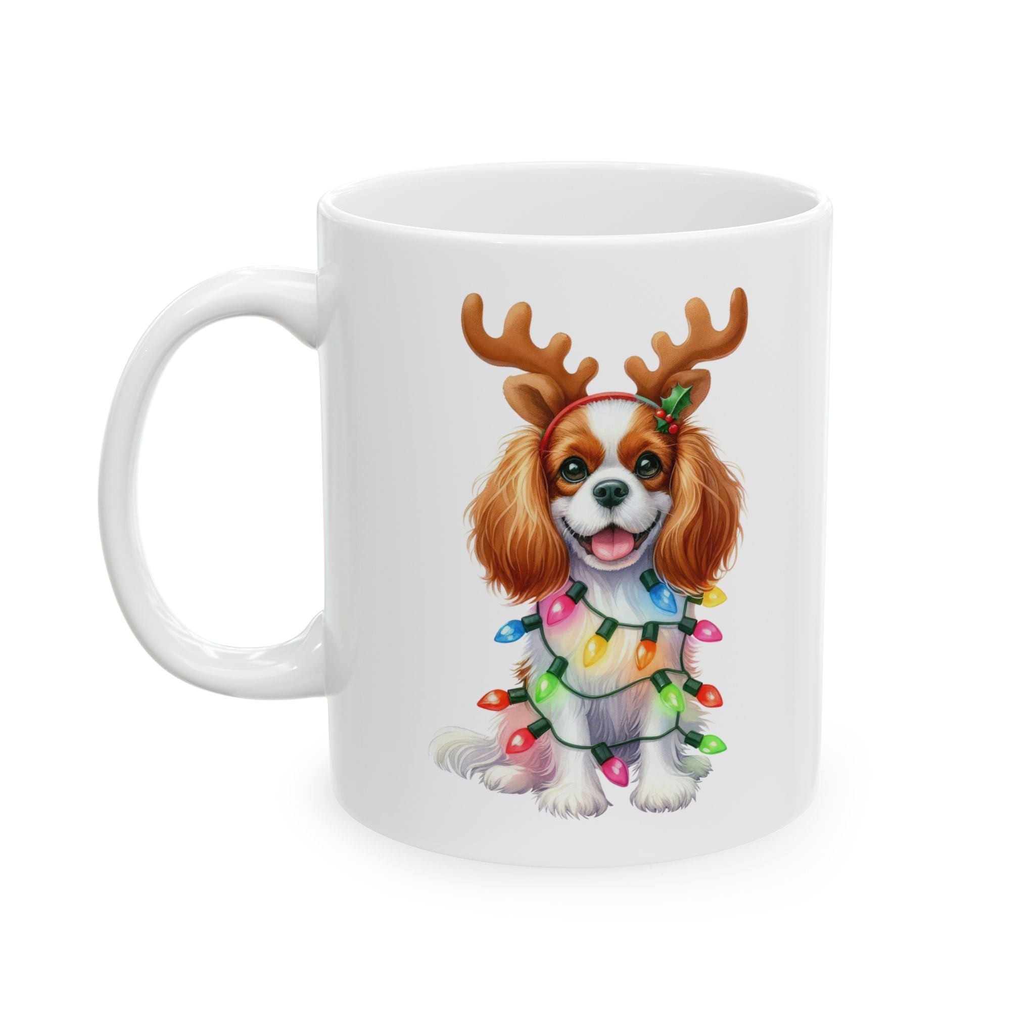 White ceramic mug with a Cavalier King Charles Spaniel wearing reindeer antlers and Christmas lights.