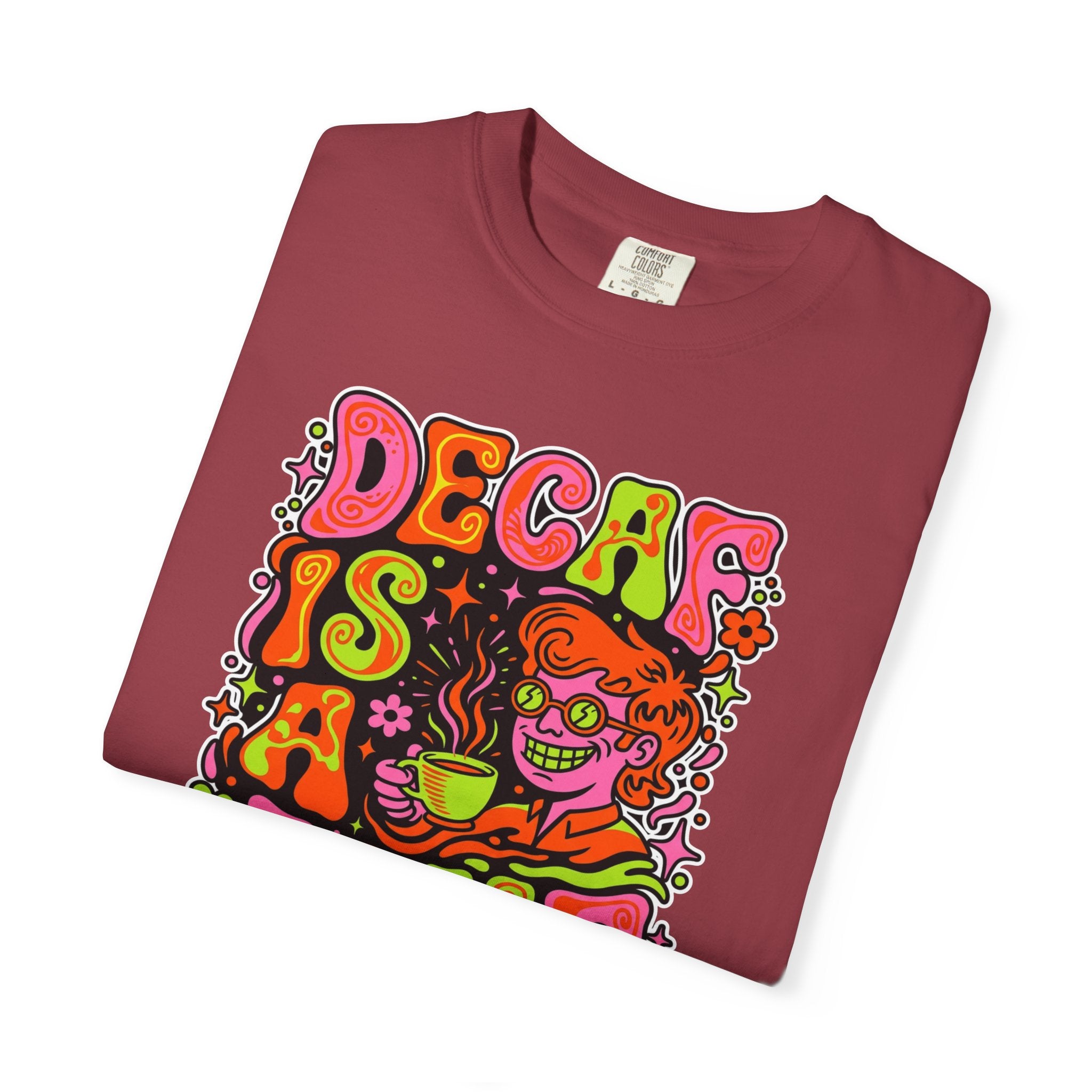 Folded maroon t-shirt featuring a retro psychedelic graphic of a person drinking coffee.