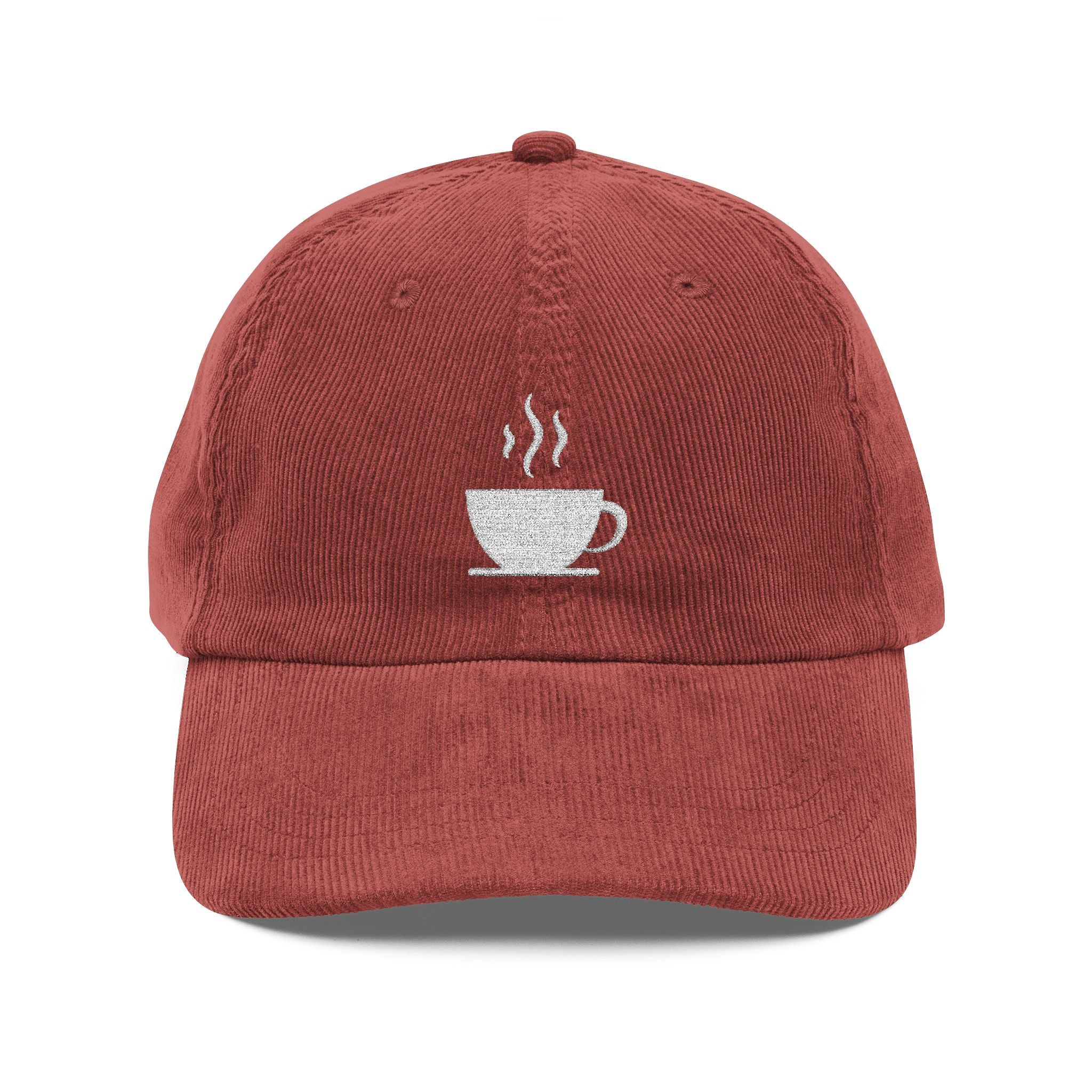 A rust-colored corduroy dad hat featuring white embroidery of a steaming coffee cup.