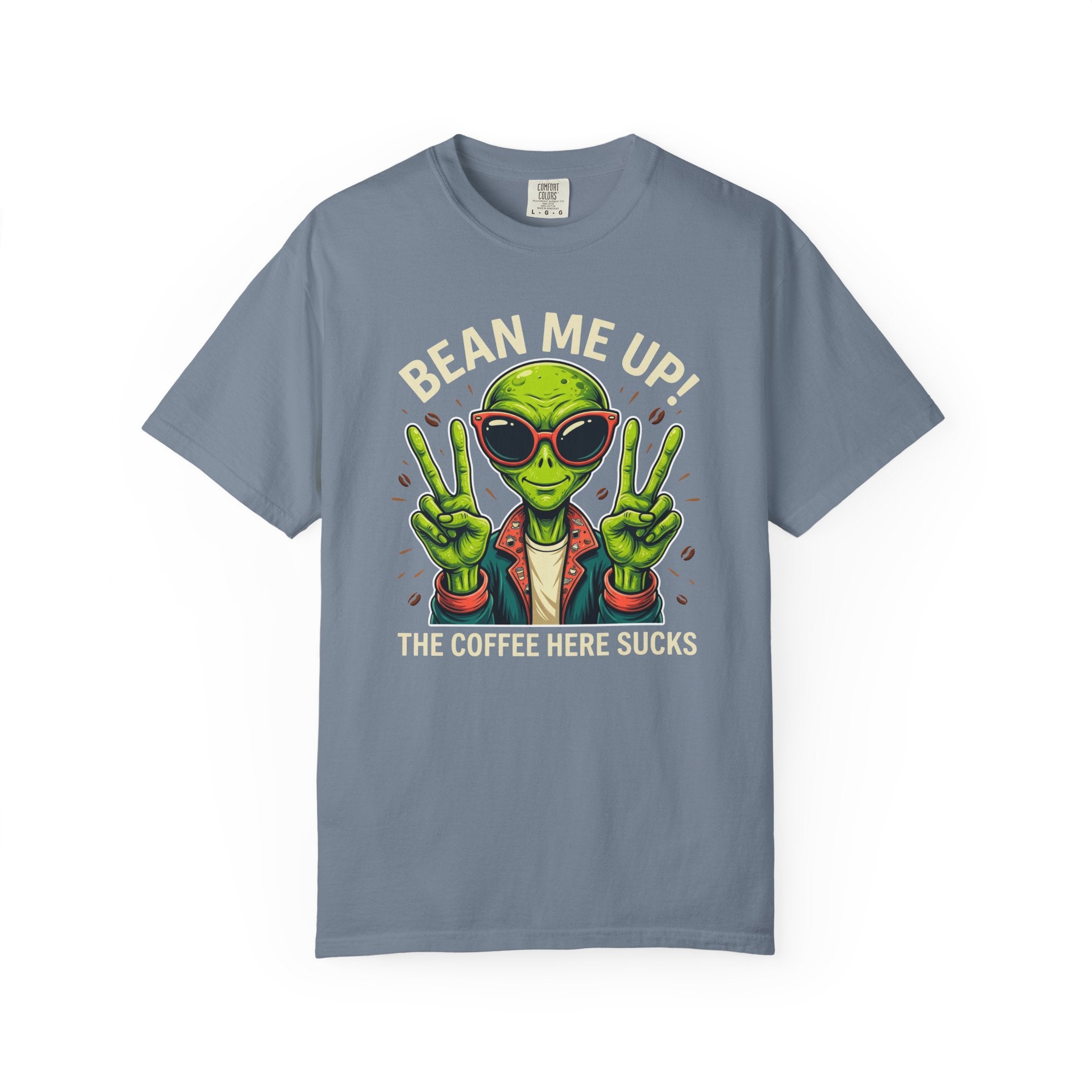 Blue-grey t-shirt featuring a green alien wearing sunglasses and making peace signs.