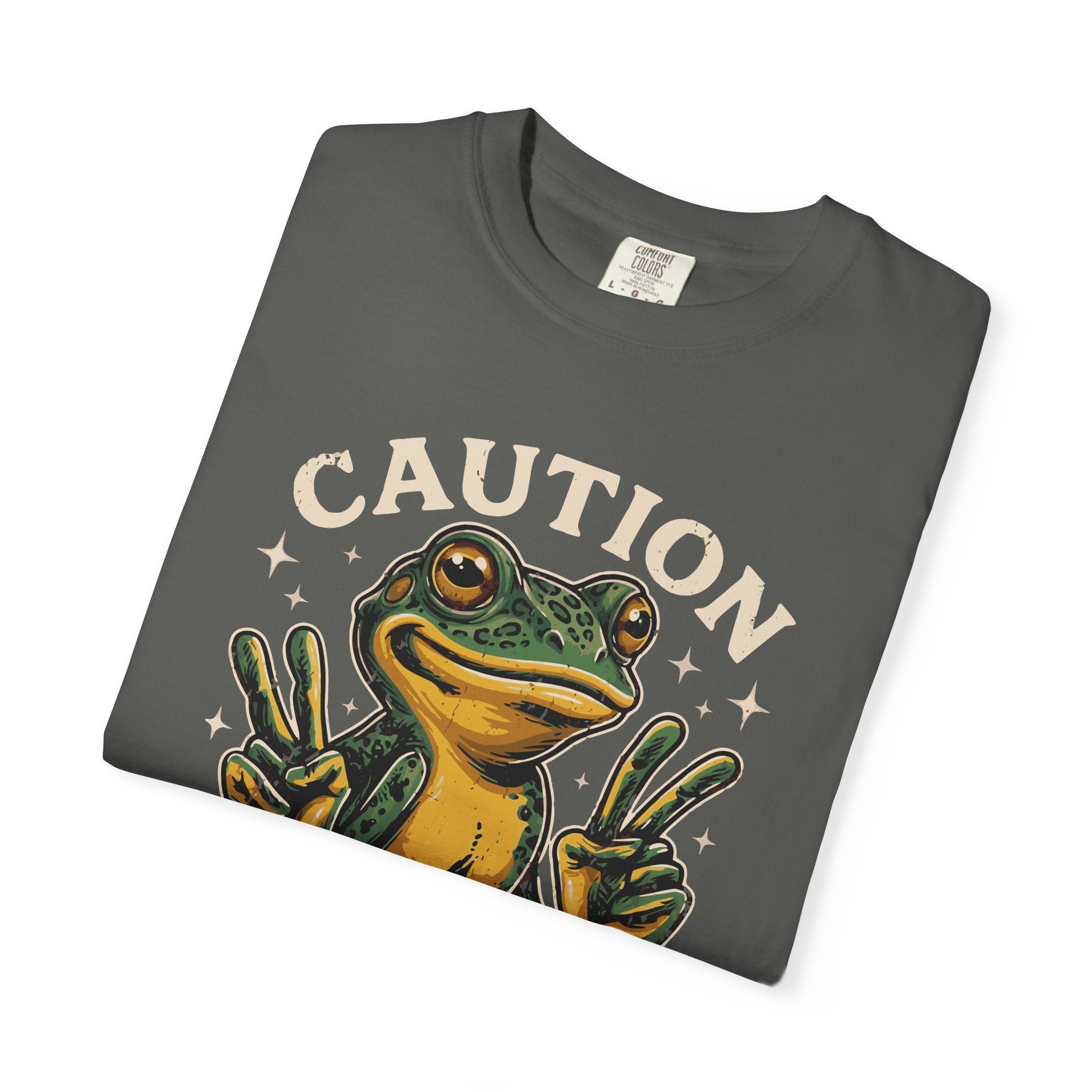 Dark grey t-shirt featuring a graphic of a smiling frog making peace signs with both hands.