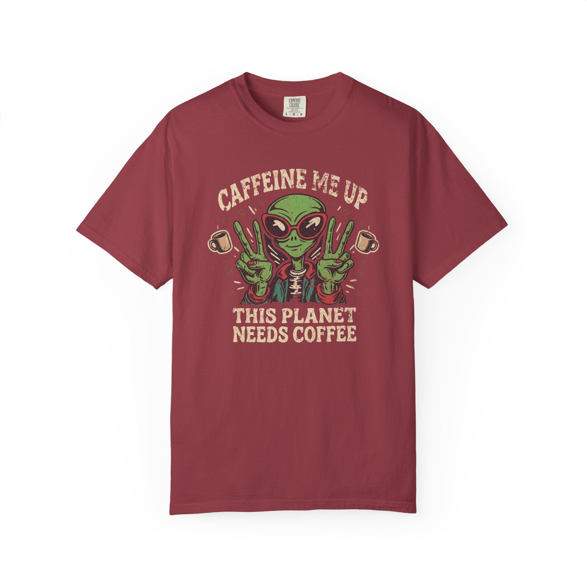 A maroon unisex cotton t-shirt featuring a distressed graphic of an alien making peace signs.