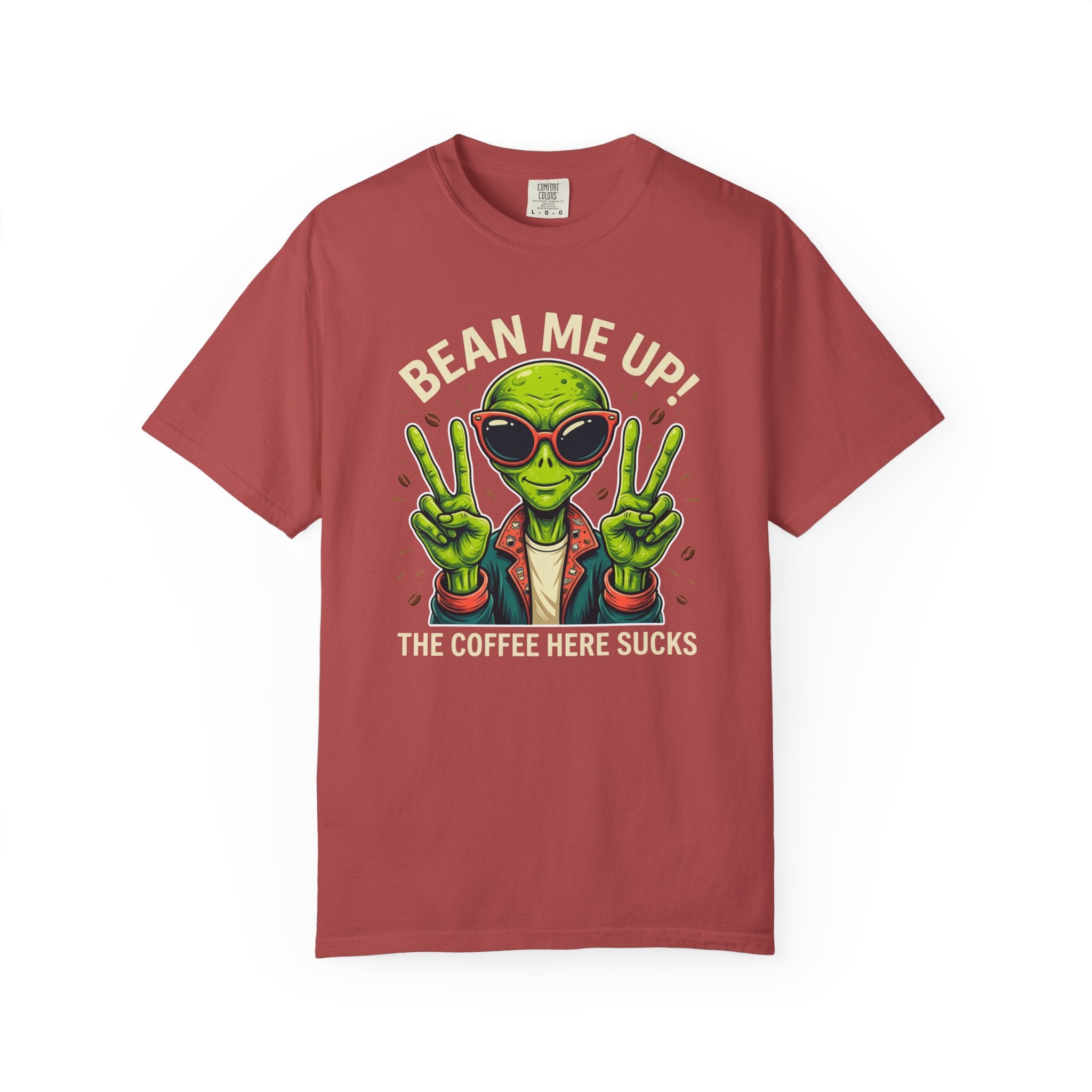 Red t-shirt featuring a green alien wearing sunglasses and making peace signs with coffee beans.