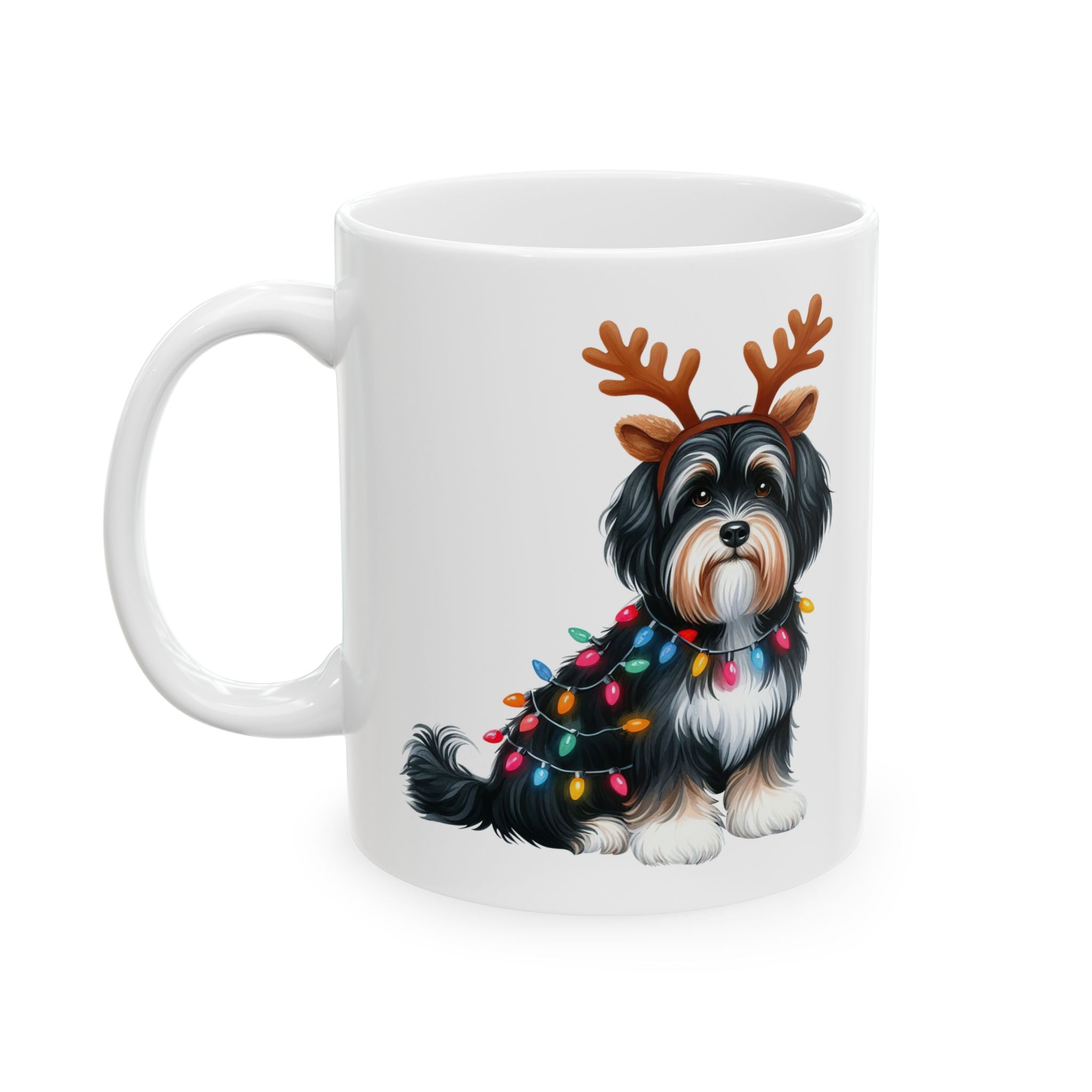 White ceramic mug featuring a Havanese dog wearing reindeer antlers and Christmas lights.