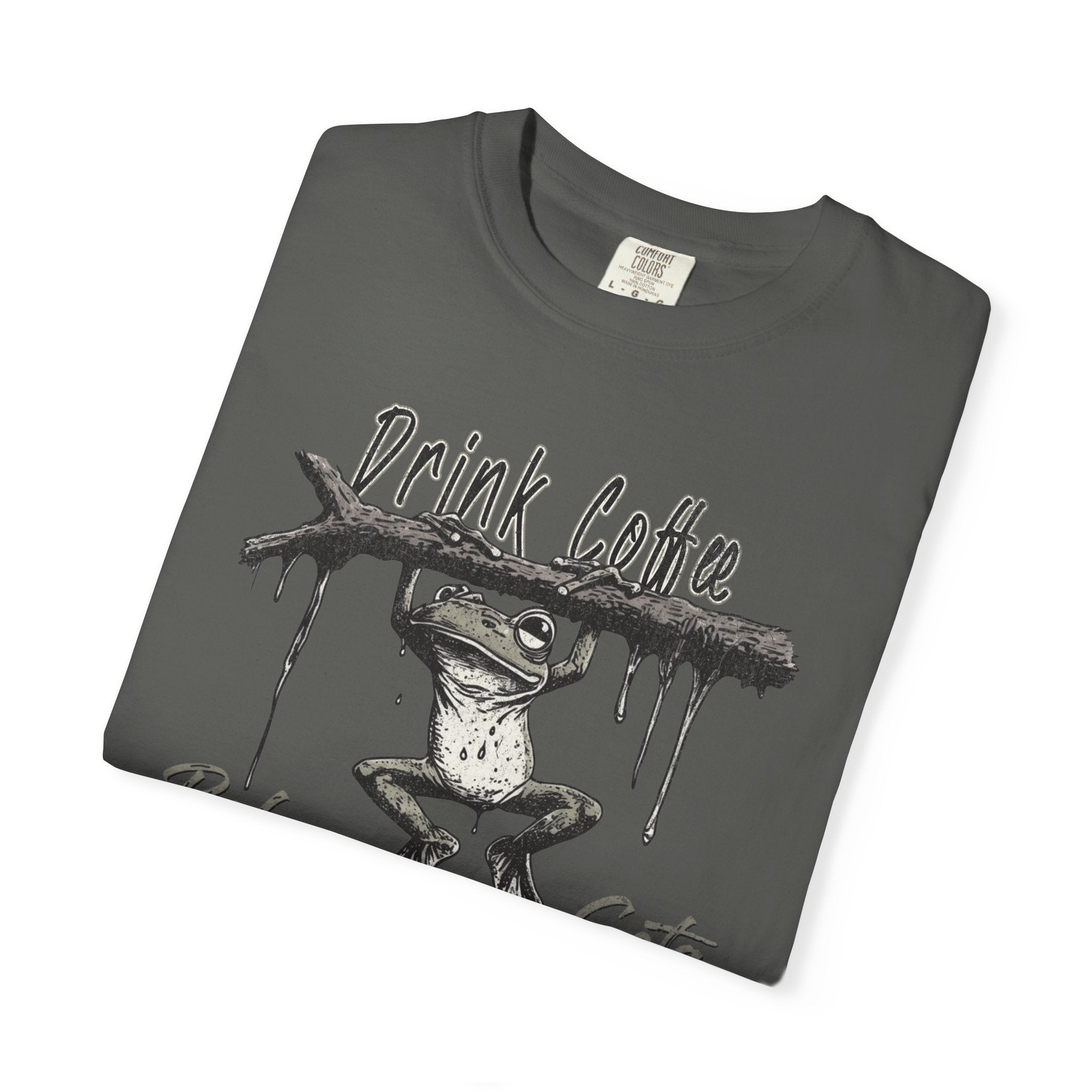 A dark grey unisex t-shirt featuring a graphic of a frog hanging from a branch with coffee text.