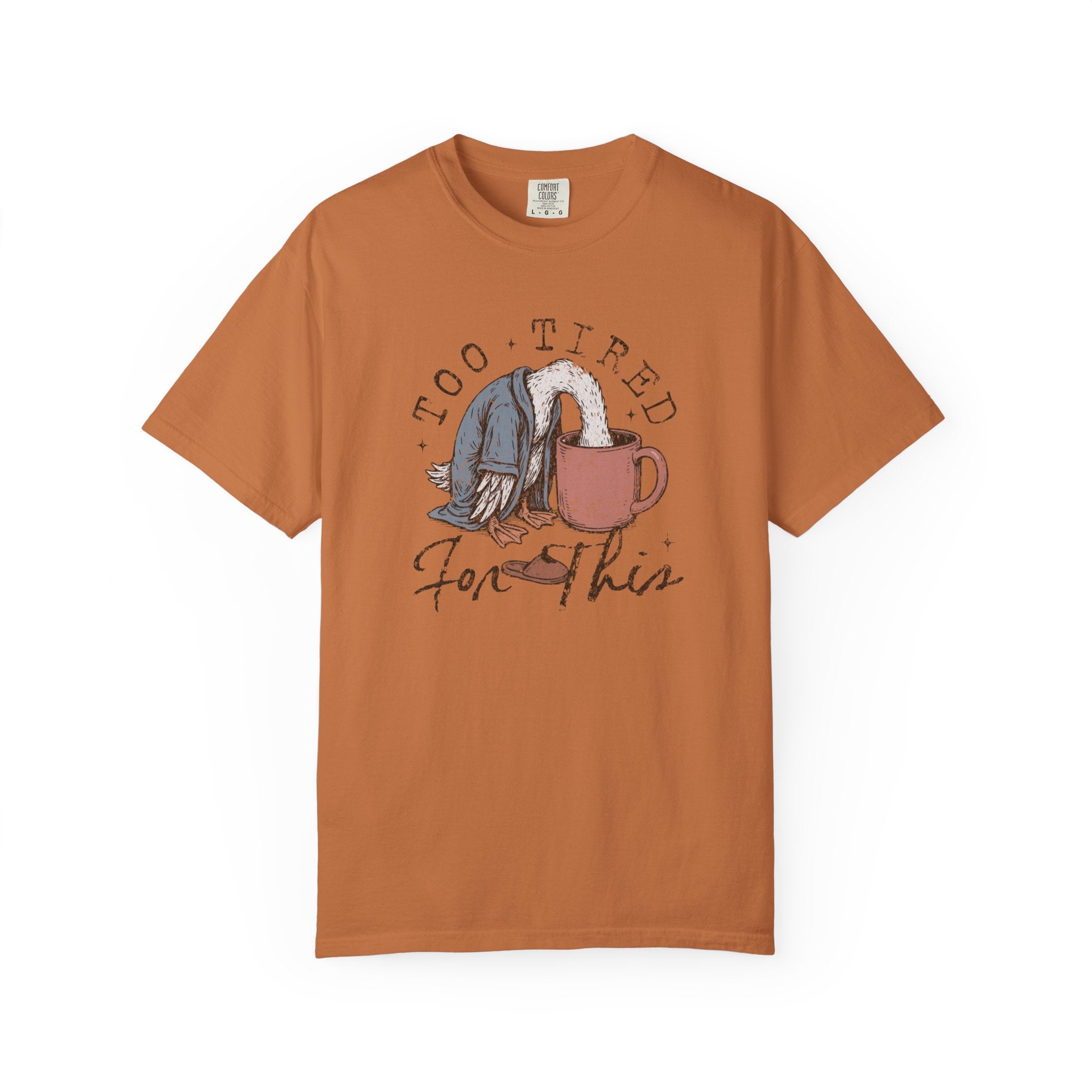 Rust-colored unisex t-shirt featuring a graphic of a bird with its head in a coffee mug.