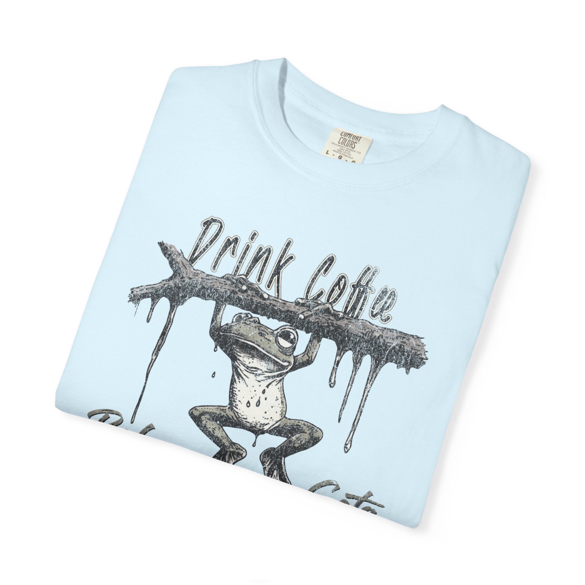 Light blue unisex cotton t-shirt featuring a distressed graphic of a frog hanging from a branch.