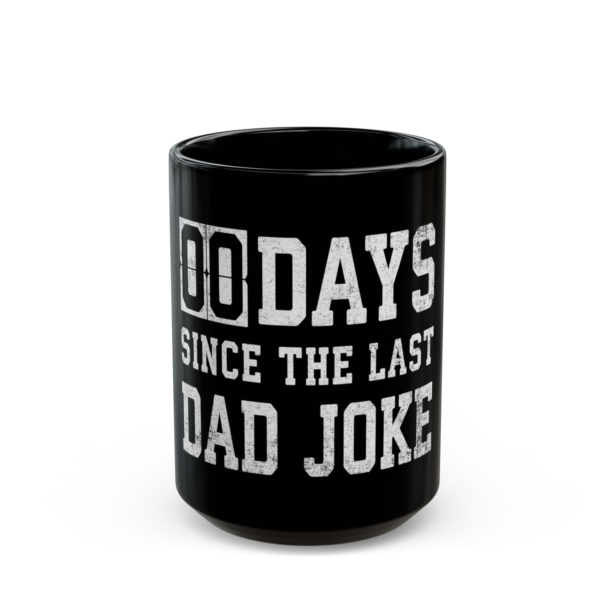 A black coffee mug with the white text 00 DAYS SINCE THE LAST DAD JOKE.