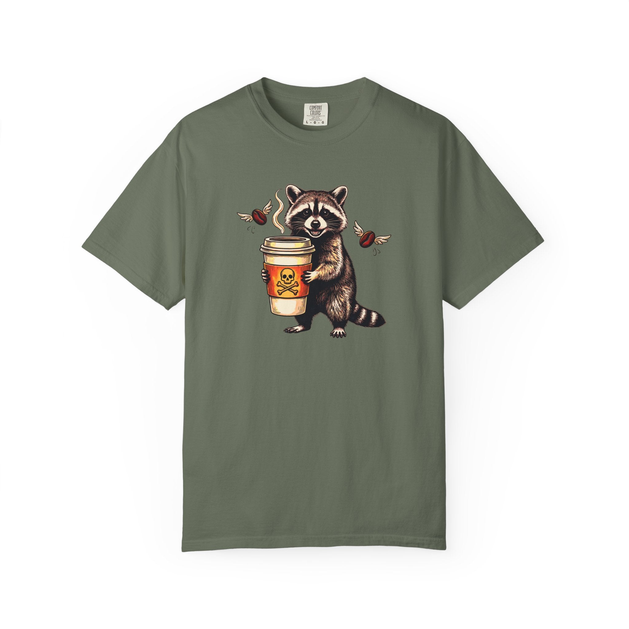 Olive green Comfort Colors 1717 unisex t-shirt featuring a raccoon holding a coffee cup.