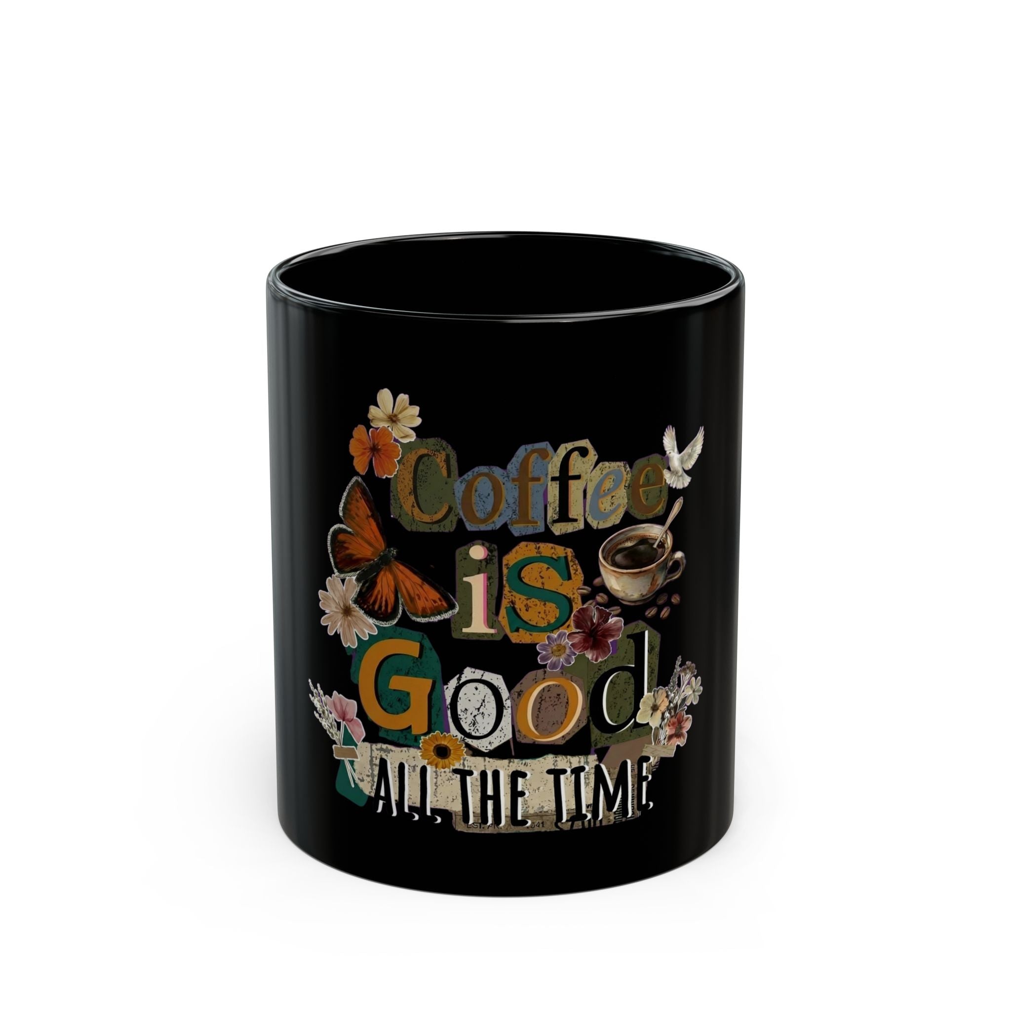 A black ceramic mug featuring a cottagecore design with flowers, a butterfly, and coffee text.