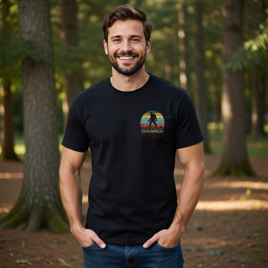 Man wearing a black t-shirt with a retro Bigfoot Social Distancing Champion graphic.