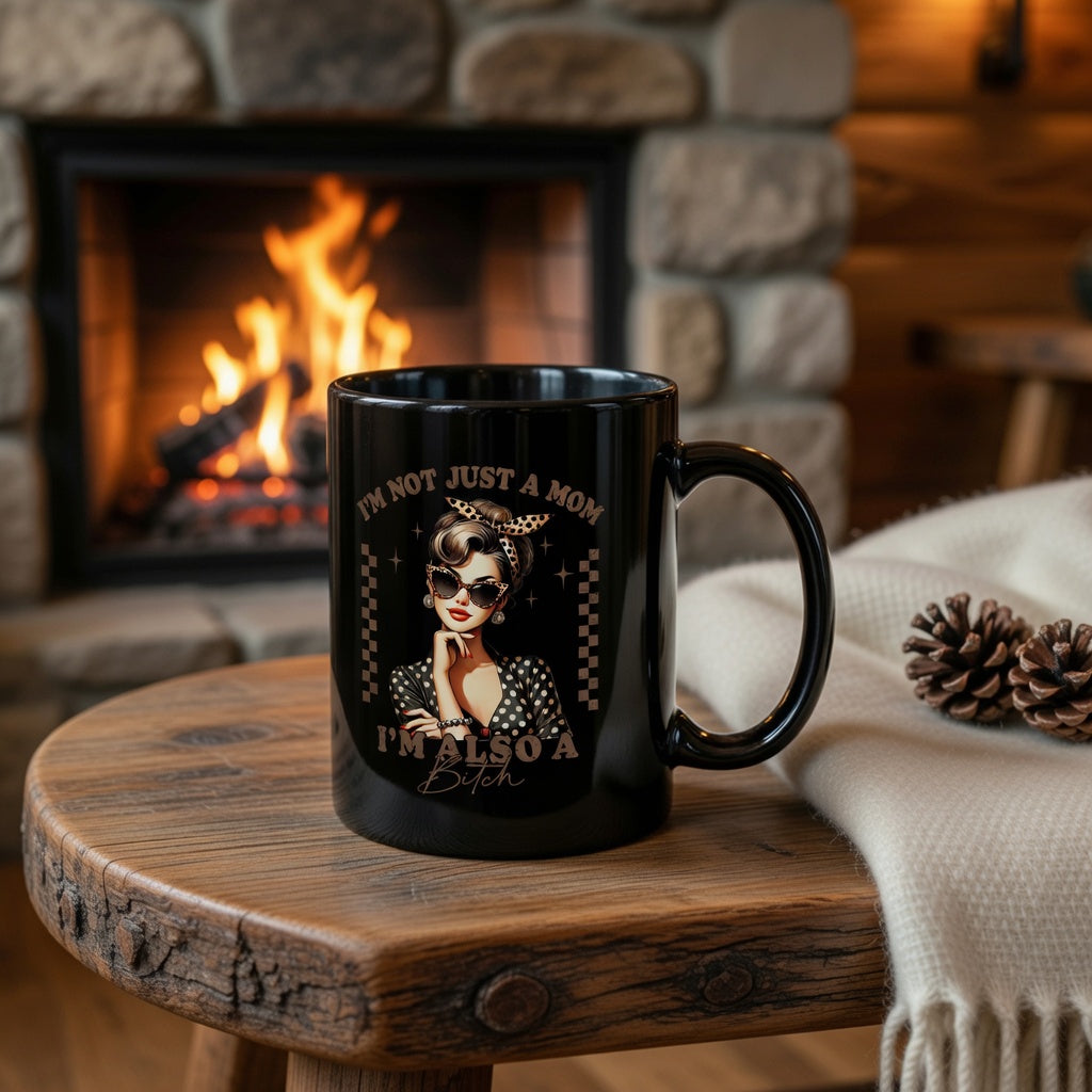 Black ceramic mug featuring a retro pin-up woman and the text I’m Not Just a Mom, I’m Also a Bitch.