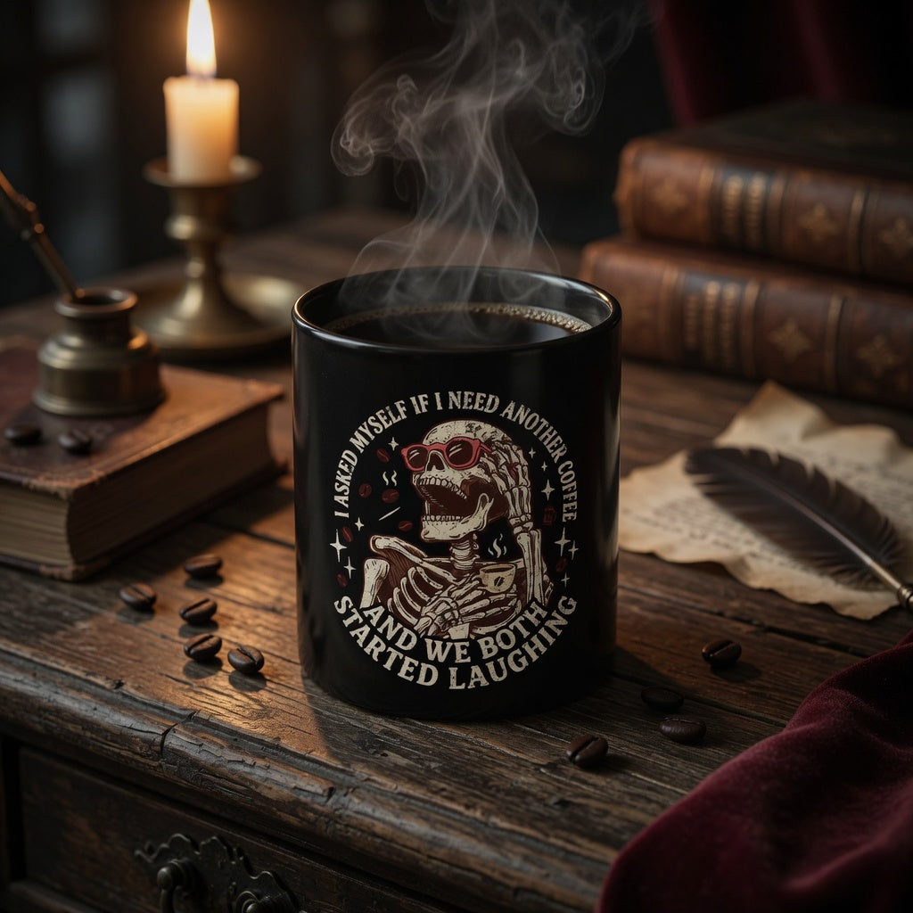 Black ceramic mug with a skeleton graphic and humorous coffee quote on a rustic wooden desk.