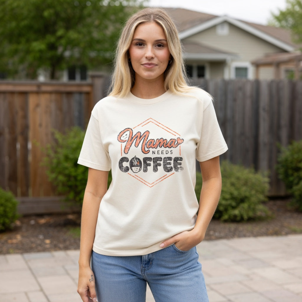 Woman wearing an Ivory Mama Needs Coffee graphic T-shirt.