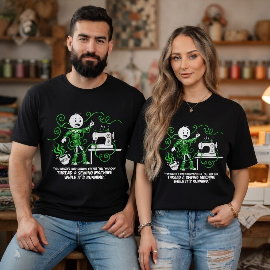 A man and woman wearing black t-shirts with a funny sewing-themed graphic and text.