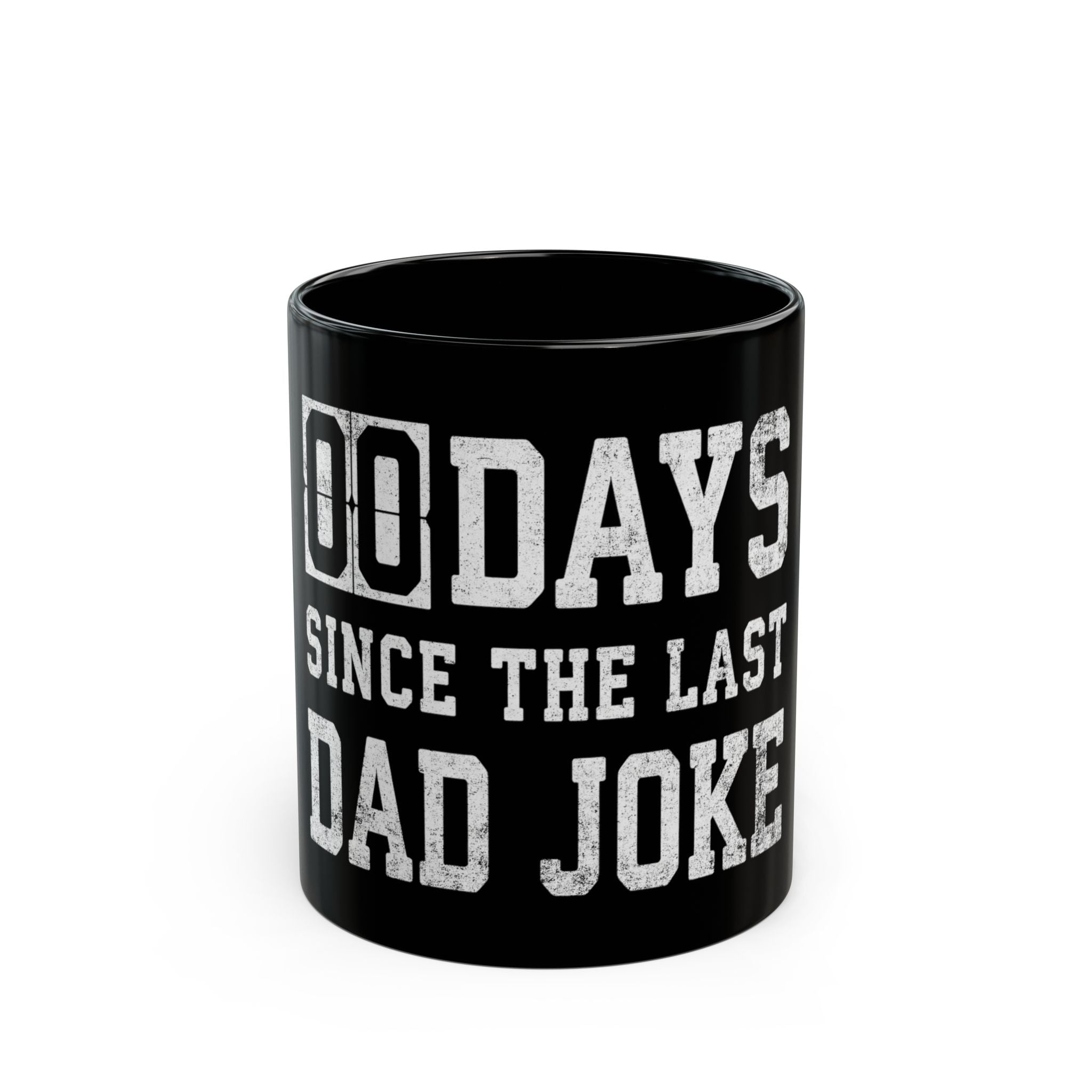 Black coffee mug with white text that reads 00 DAYS SINCE THE LAST DAD JOKE.