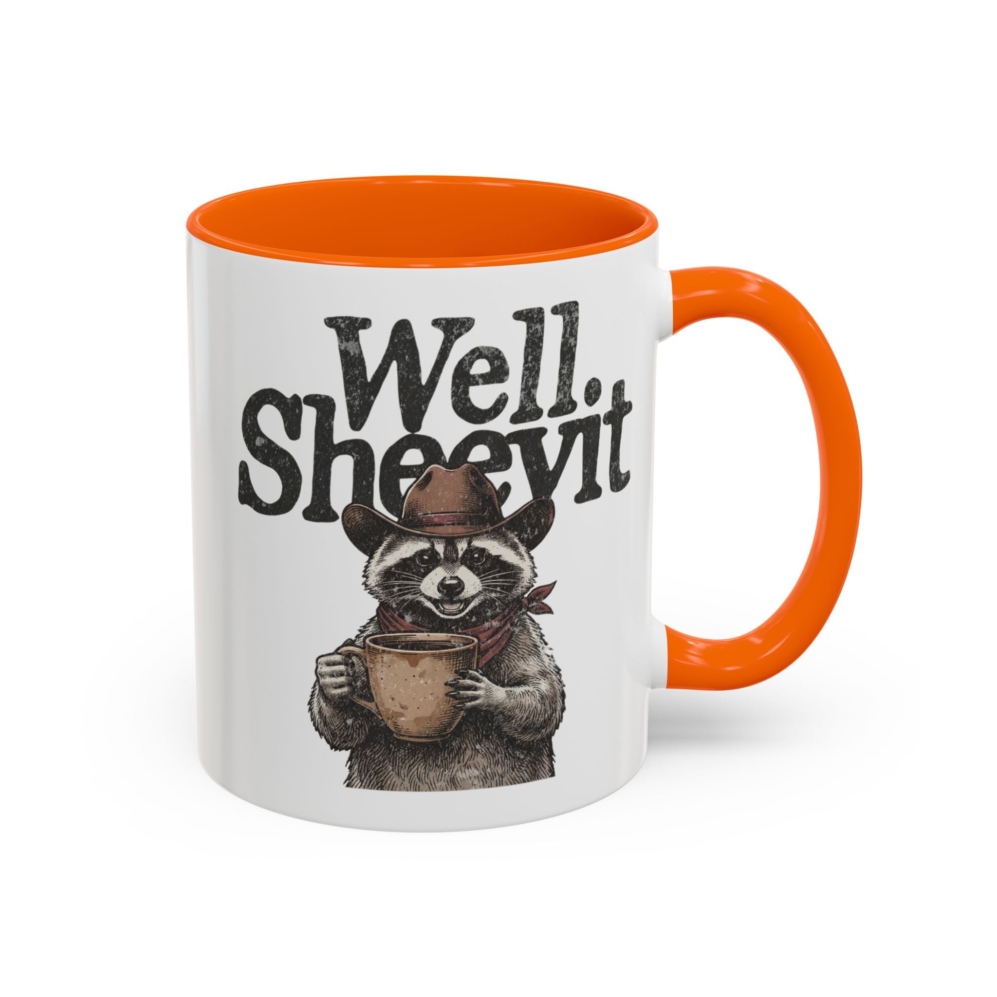 White ceramic mug with an orange handle and rim, featuring a raccoon in a cowboy hat holding a mug.