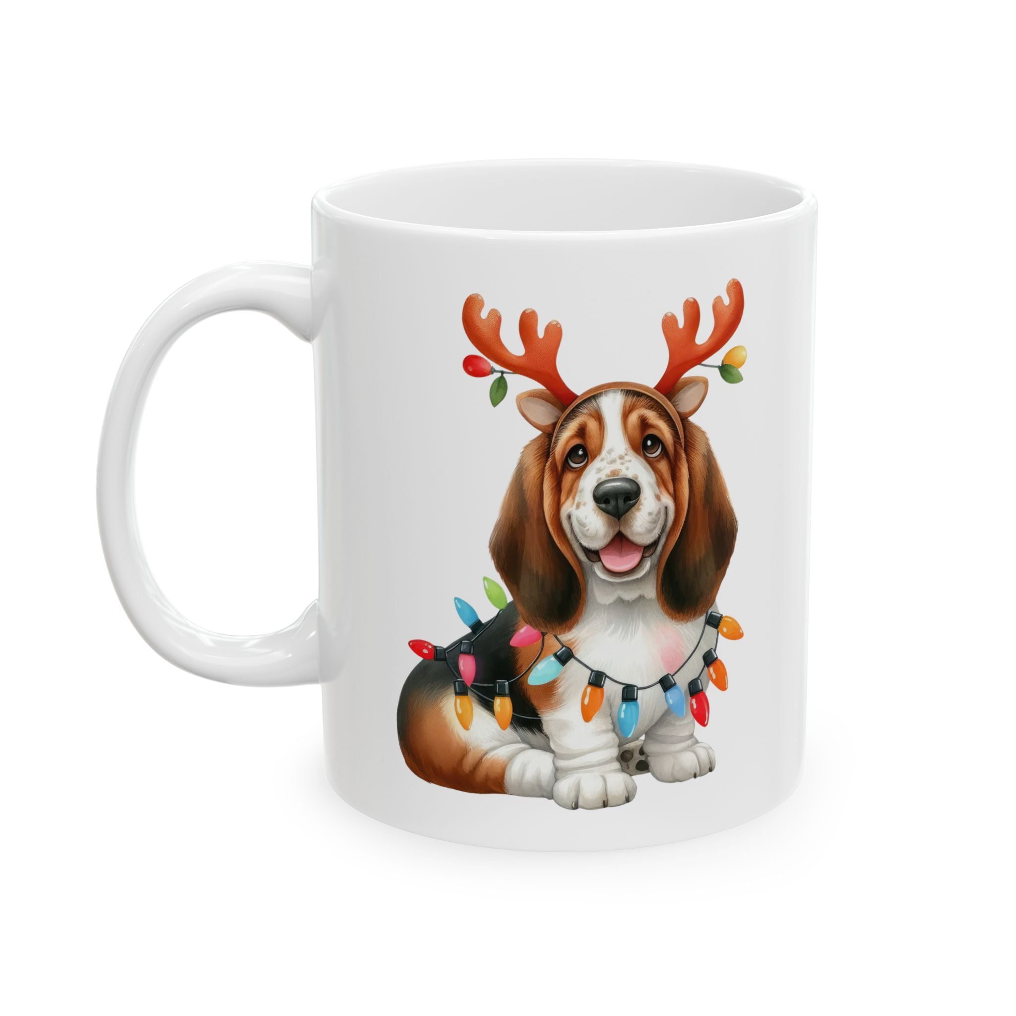 A white ceramic mug features a basset hound wearing reindeer antlers and Christmas lights.