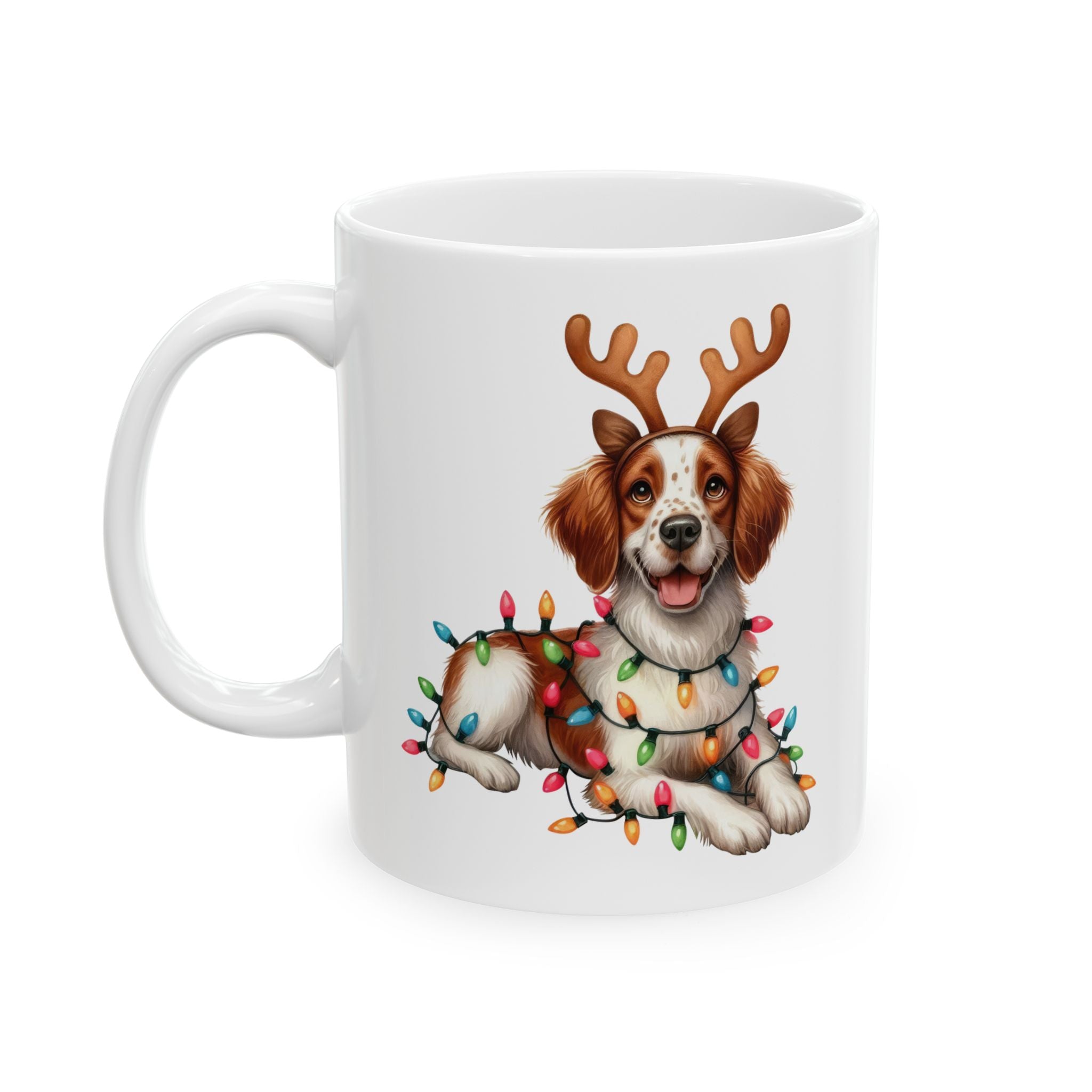 White ceramic mug featuring a Brittany dog wearing reindeer antlers and Christmas lights.