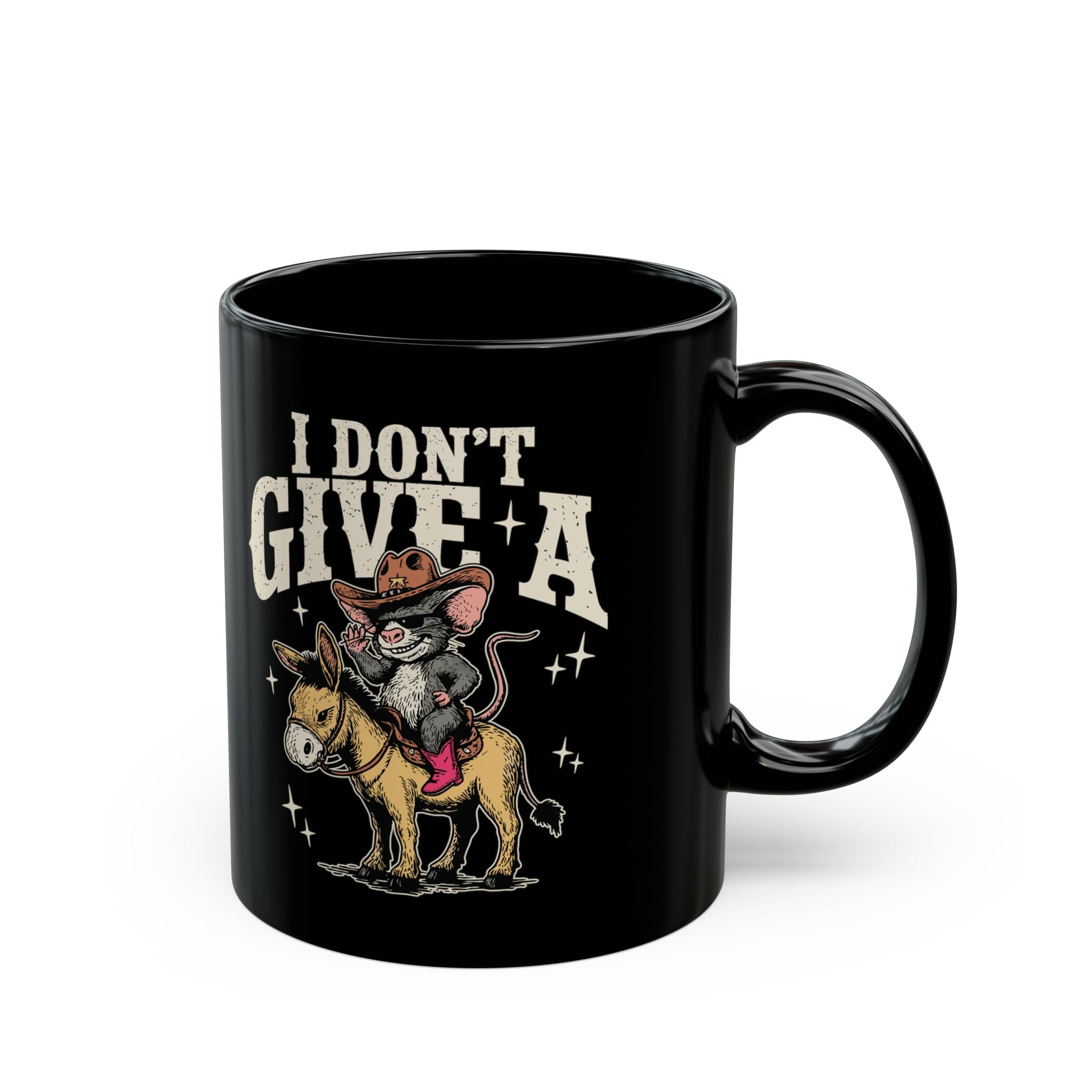 Black coffee mug featuring a graphic of a cowboy mouse riding a donkey with text I Don't Give A.