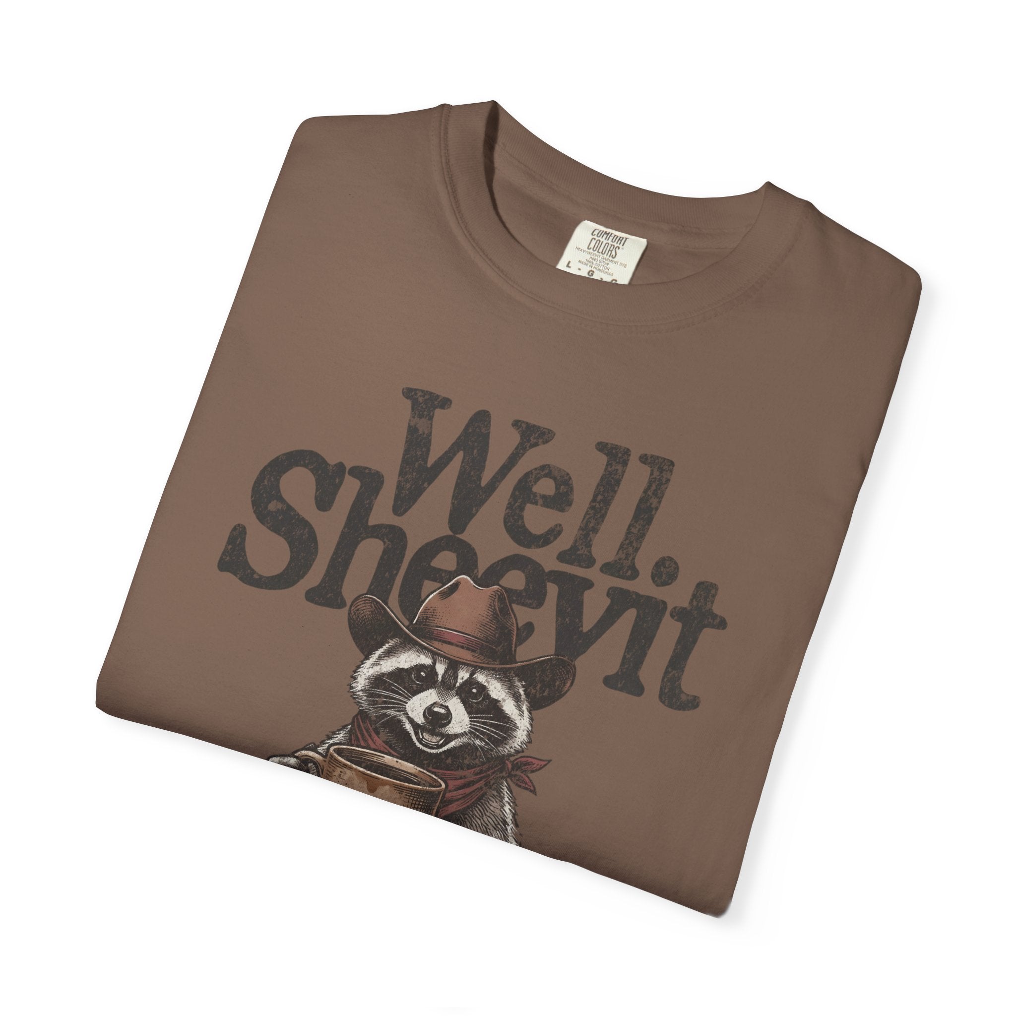 Brown t-shirt featuring a graphic of a raccoon in a cowboy hat holding a coffee mug.
