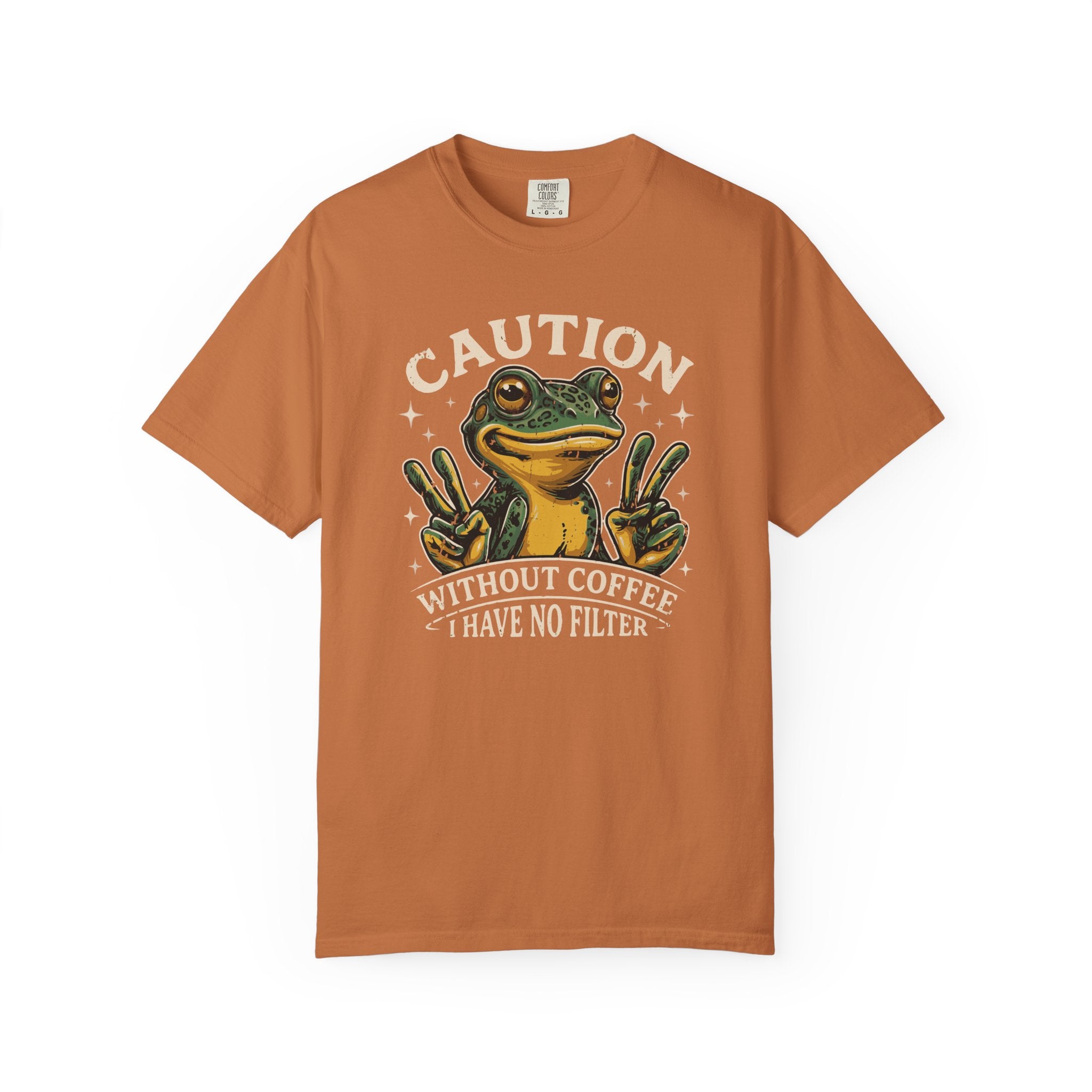 Orange t-shirt featuring a graphic of a frog making peace signs with the text Caution No Filter.