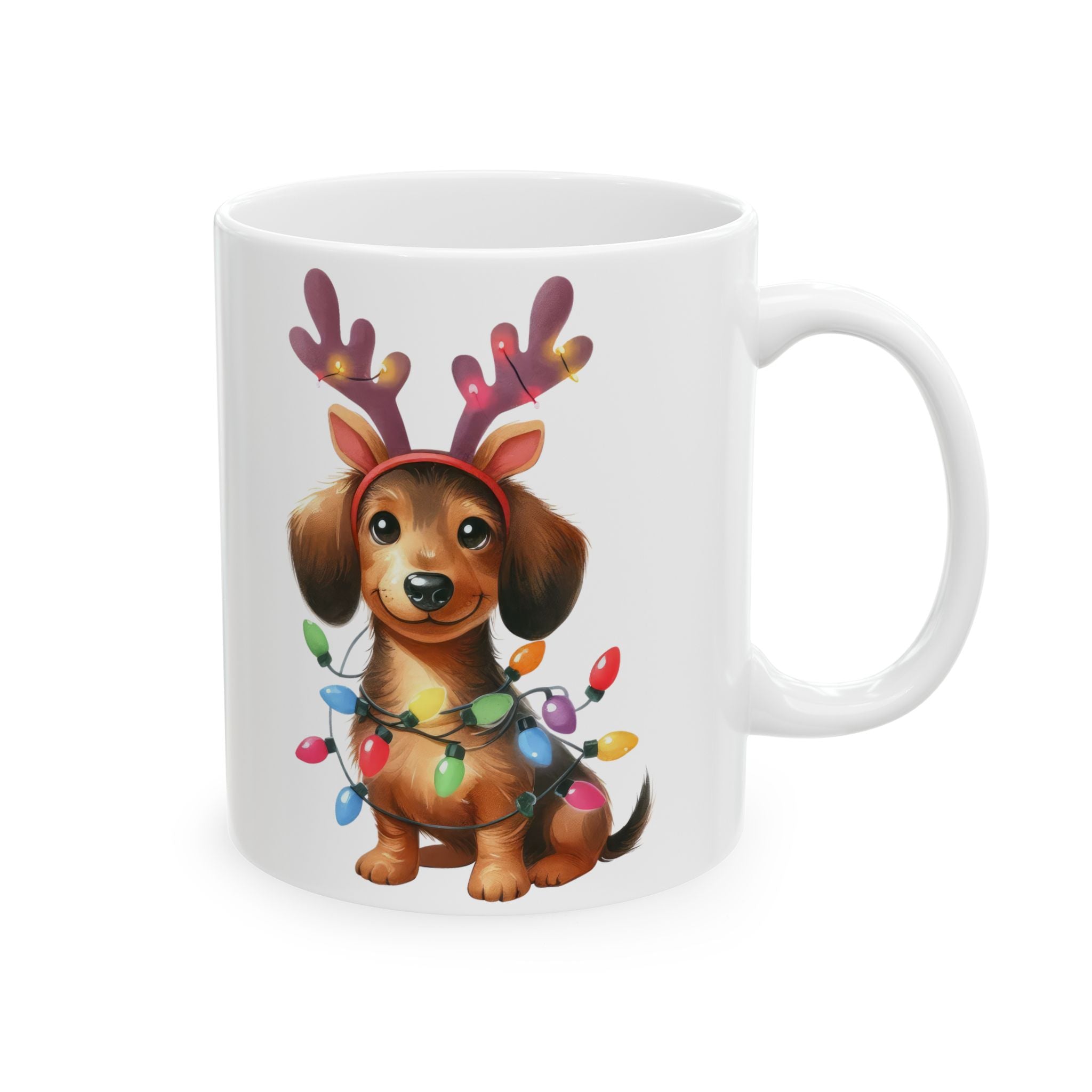White ceramic mug with a dachshund wearing reindeer antlers and wrapped in Christmas lights.