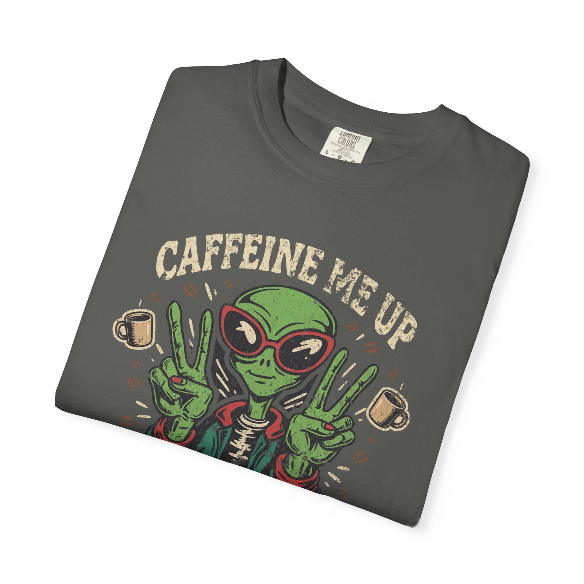 Folded charcoal grey unisex cotton t-shirt with a distressed alien graphic and coffee theme.