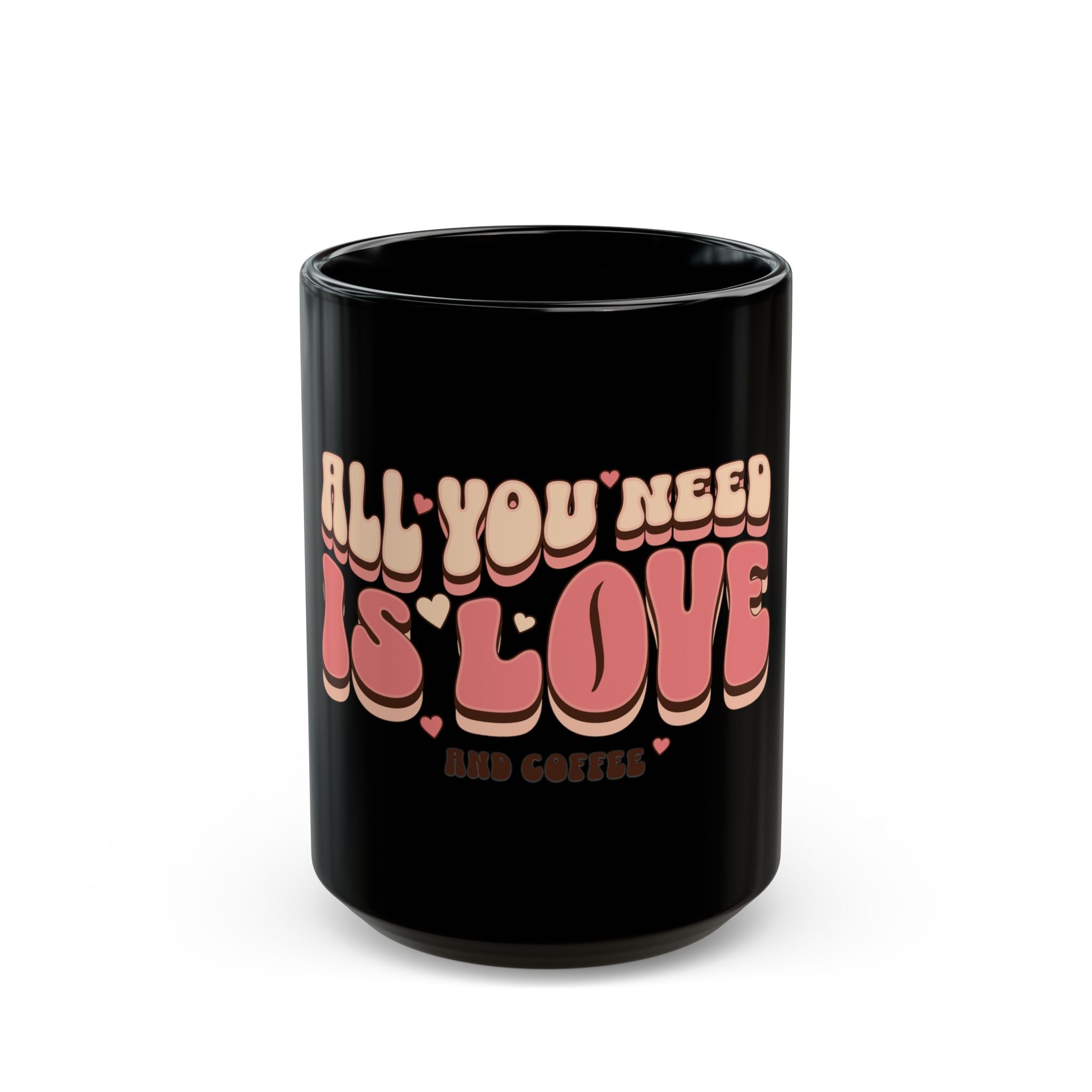Black ceramic mug with retro 70s style text reading All You Need Is Love And Coffee.
