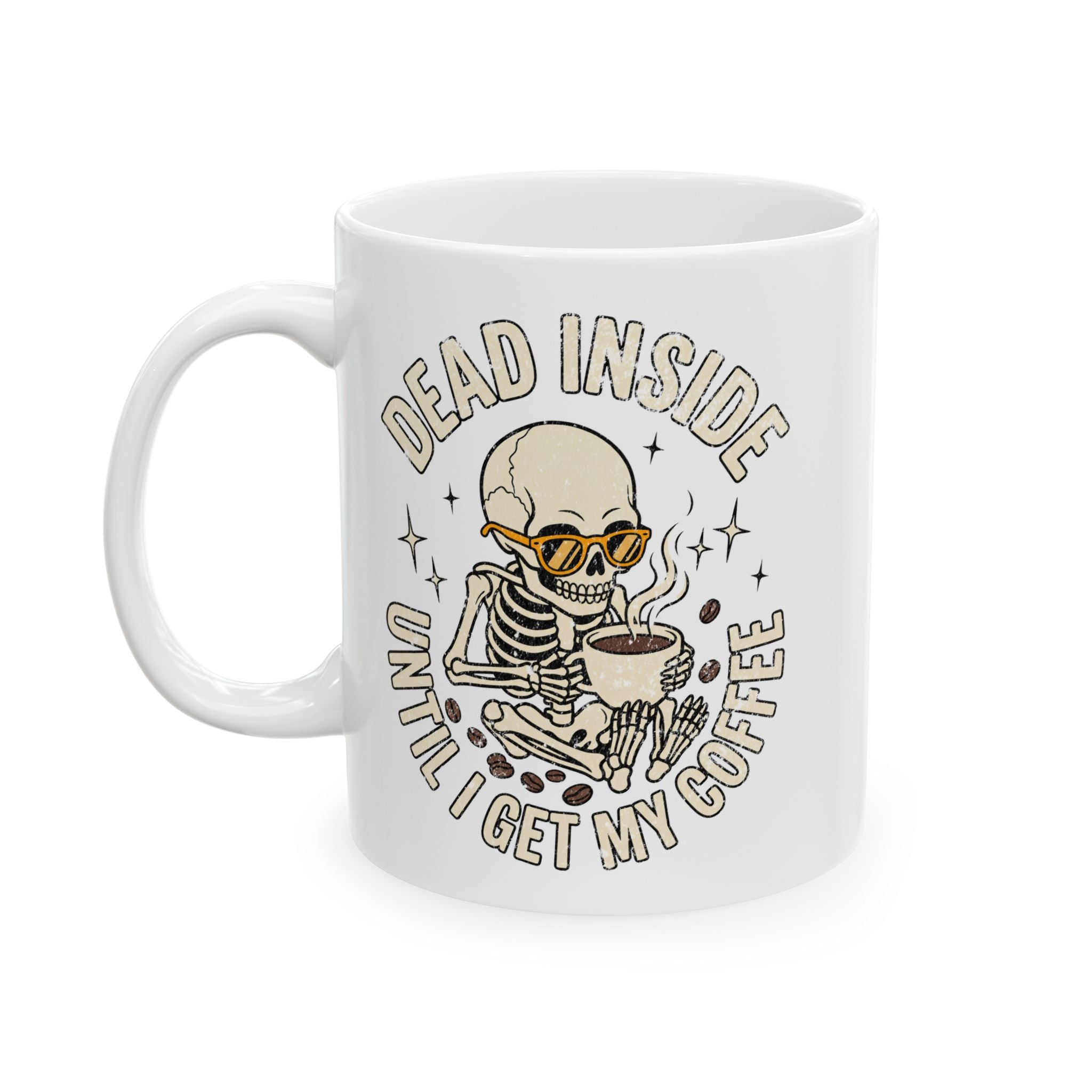 White ceramic mug featuring a skeleton wearing sunglasses and holding a steaming cup of coffee.