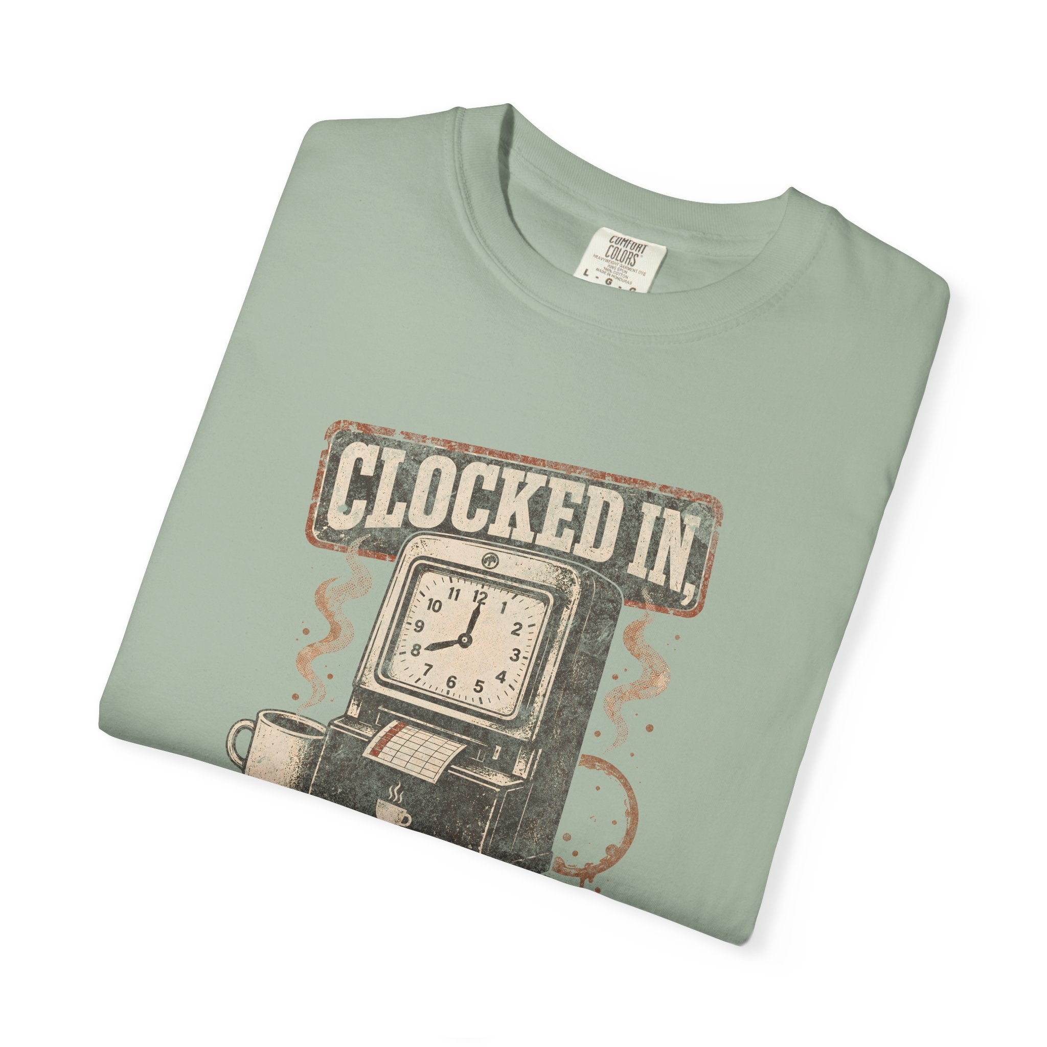 A sage green Comfort Colors t-shirt featuring a vintage clock-in machine and coffee graphic.