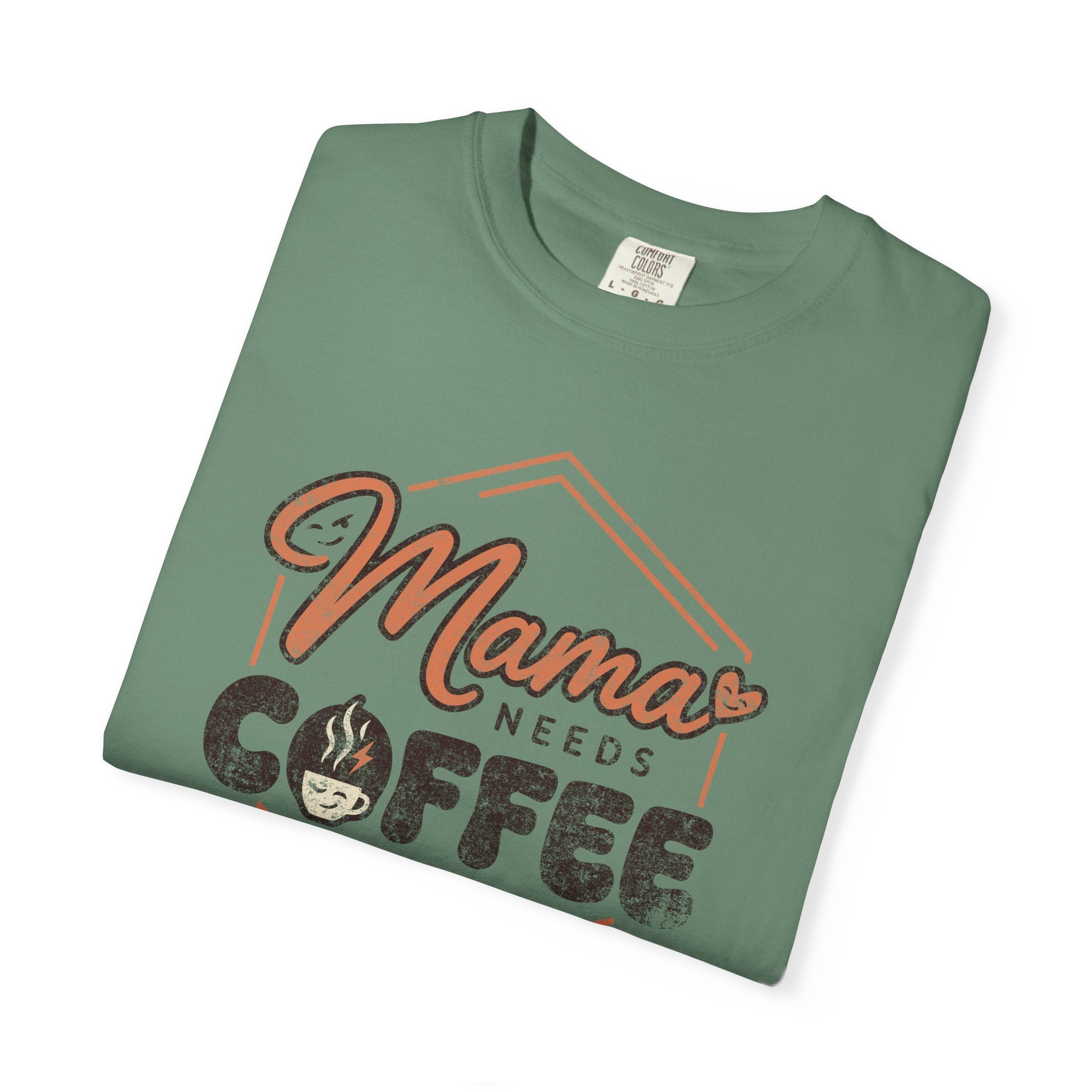 Green unisex t-shirt with a distressed Mama Needs Coffee graphic print.