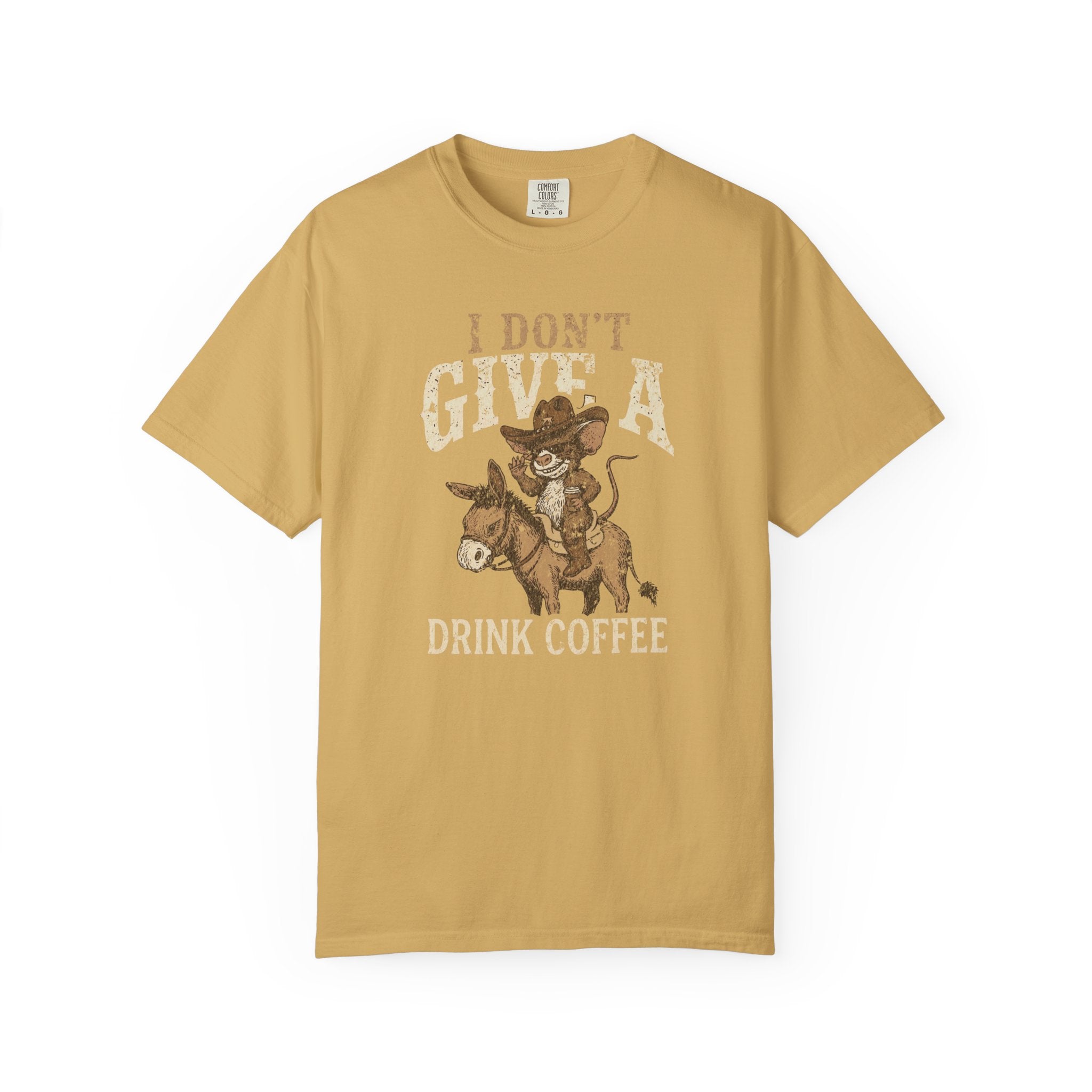 Mustard yellow t-shirt with a distressed graphic of a cowboy rat riding a donkey, drinking coffee.