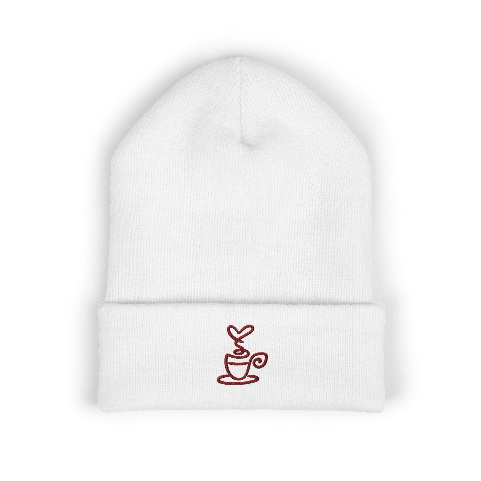 White cuffed knit beanie with an embroidered coffee cup and heart design.