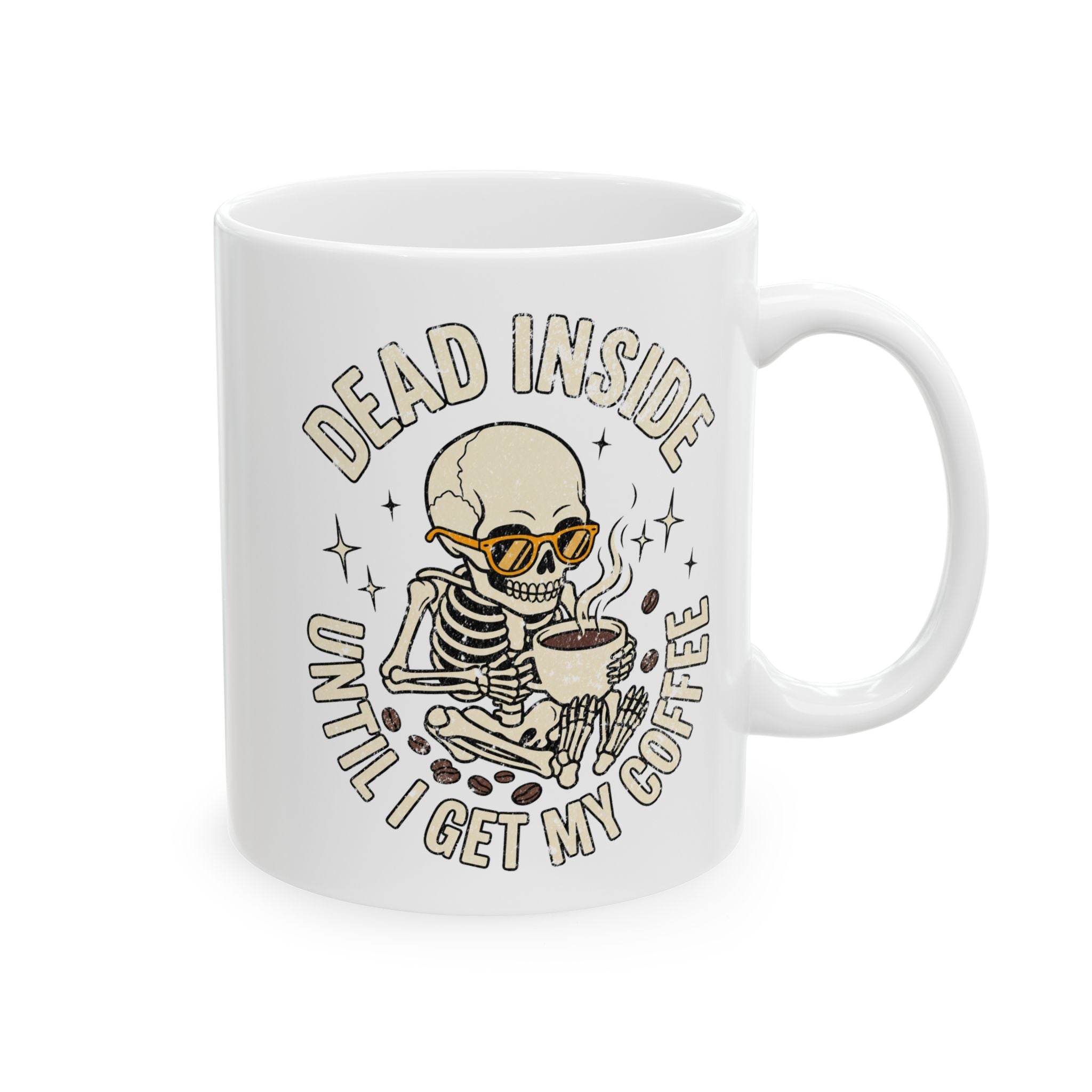 White ceramic mug featuring a skeleton wearing sunglasses and holding a steaming cup of coffee.