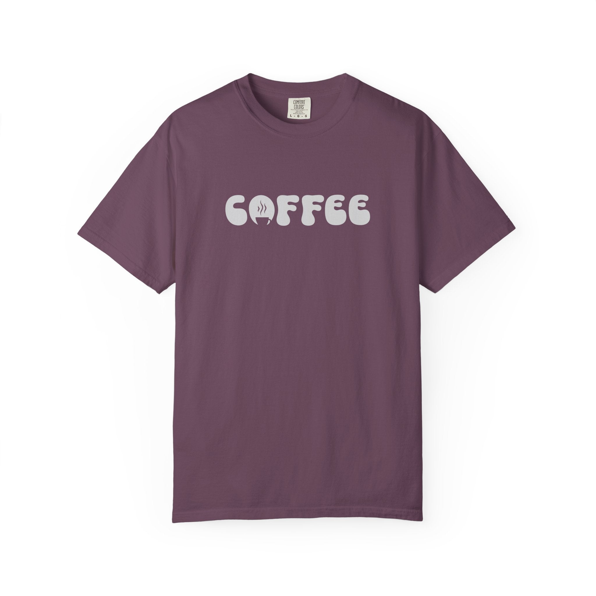 A plum-colored short-sleeve cotton t-shirt featuring the word COFFEE in a white retro bubble font.