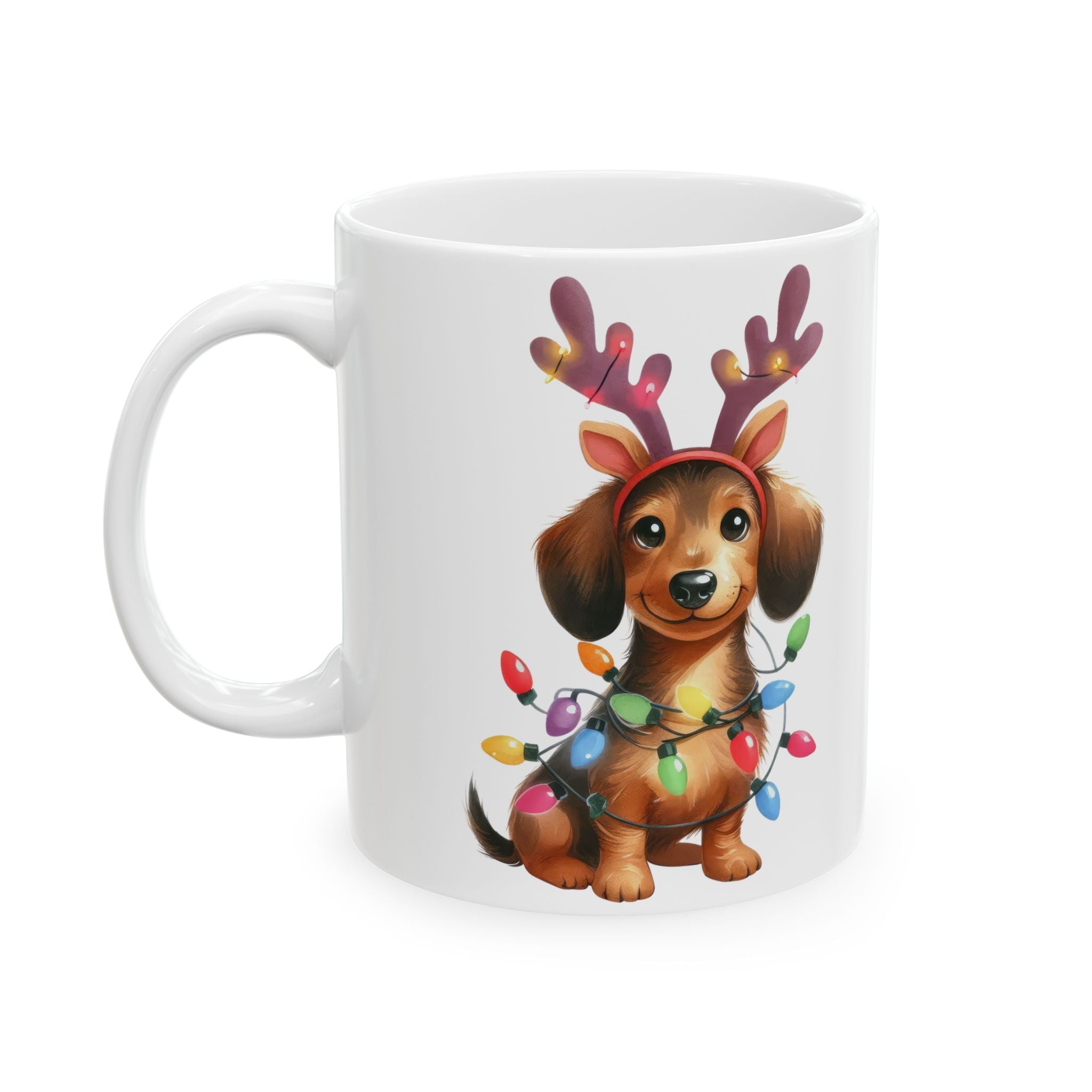 White ceramic mug with a dachshund wearing reindeer antlers and Christmas lights.