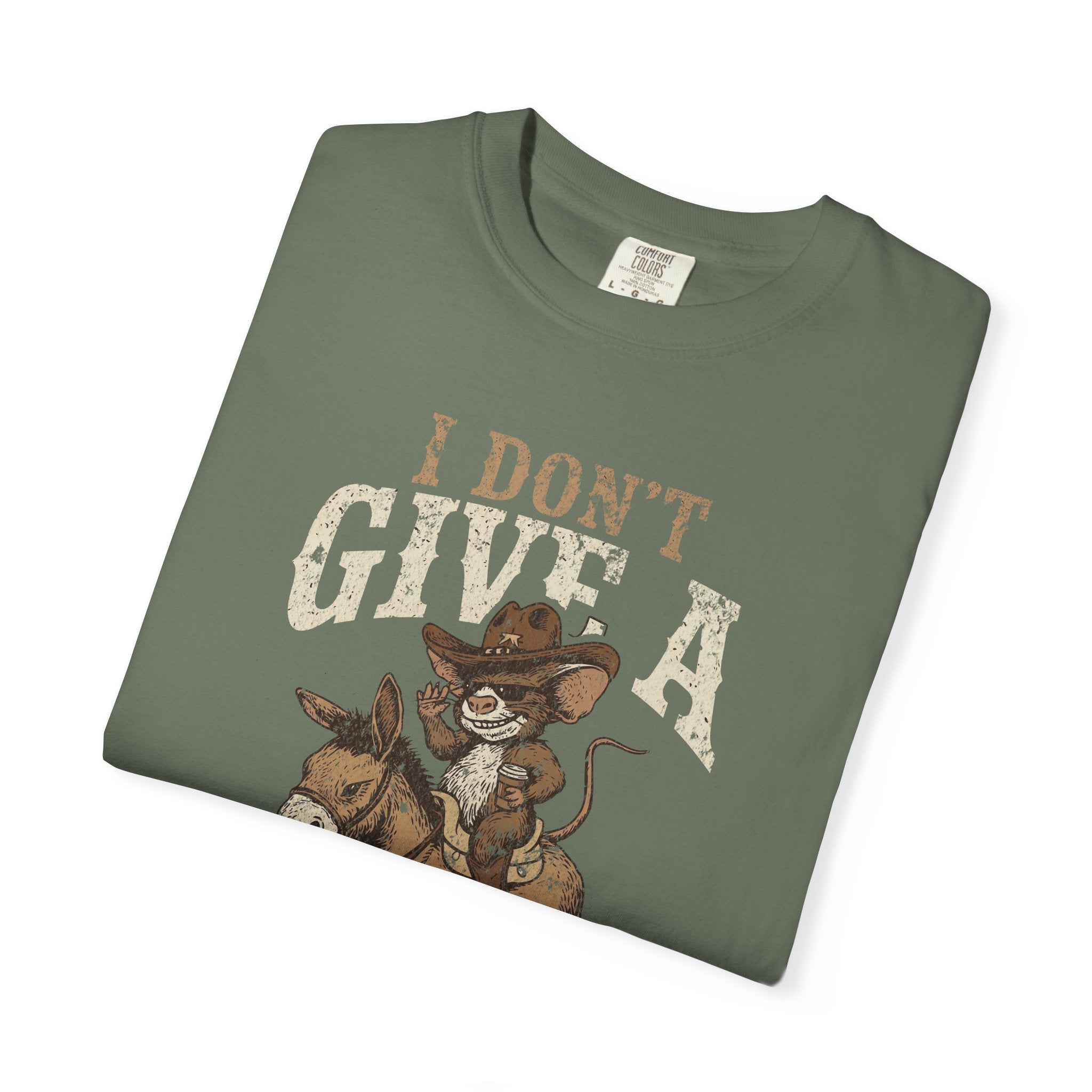 Olive green t-shirt with a graphic of a mouse in a cowboy hat riding a donkey.
