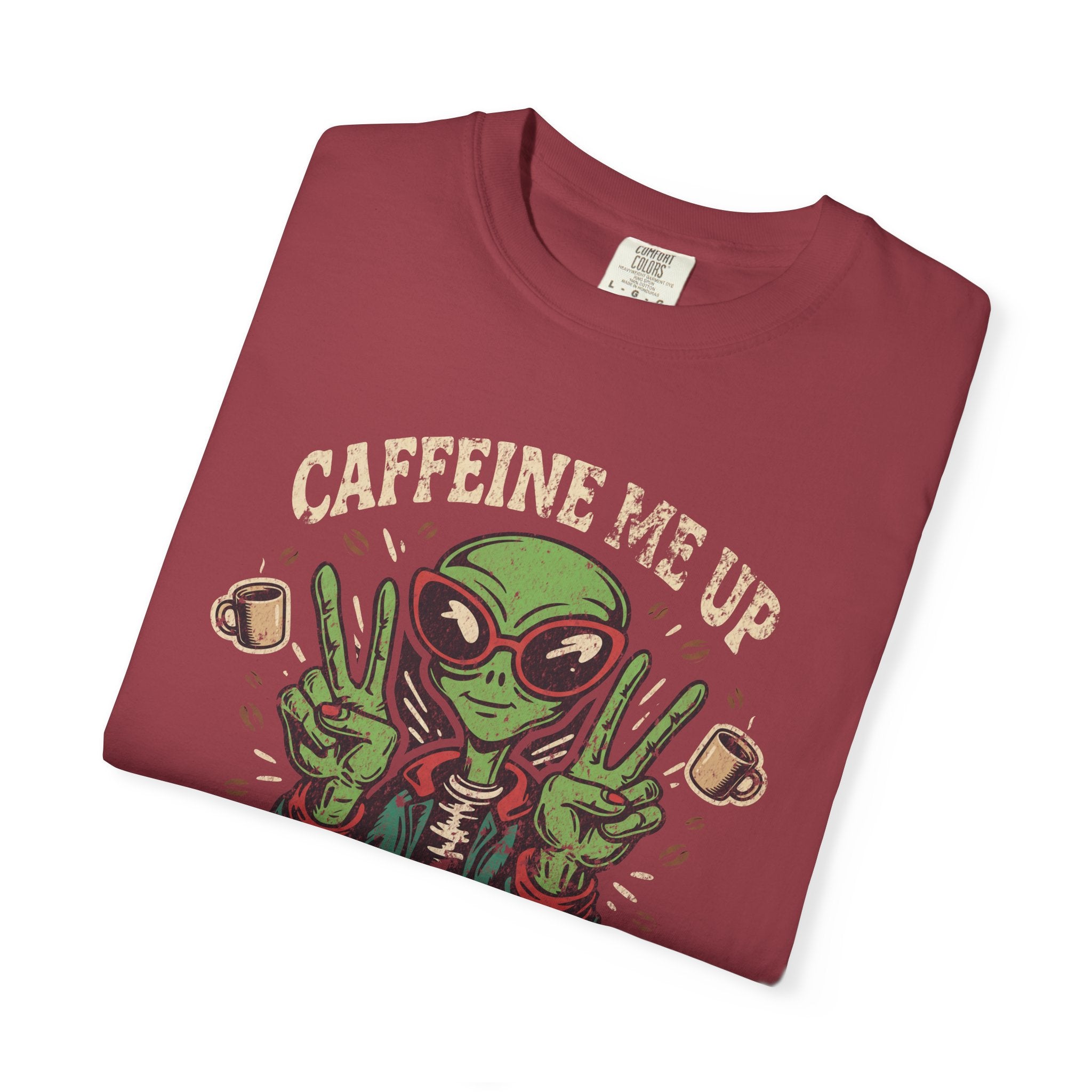 A maroon unisex cotton t-shirt featuring a distressed graphic of an alien making peace signs.