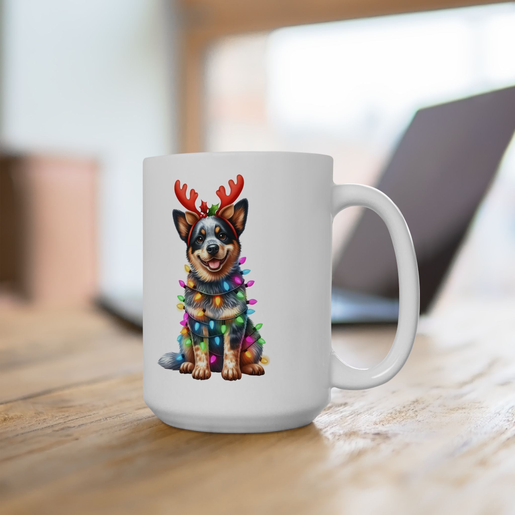White ceramic mug with an Australian Cattle Dog wearing reindeer antlers and Christmas lights.