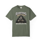 Olive green unisex t-shirt with a skeleton graphic drinking coffee and text Surviving Fatherhood.