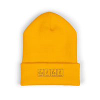 A yellow cuffed beanie with "COFFEE" embroidered in periodic table style.