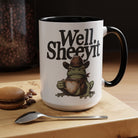White ceramic mug featuring a cowboy frog holding a coffee cup with the text Well Sheeyit.