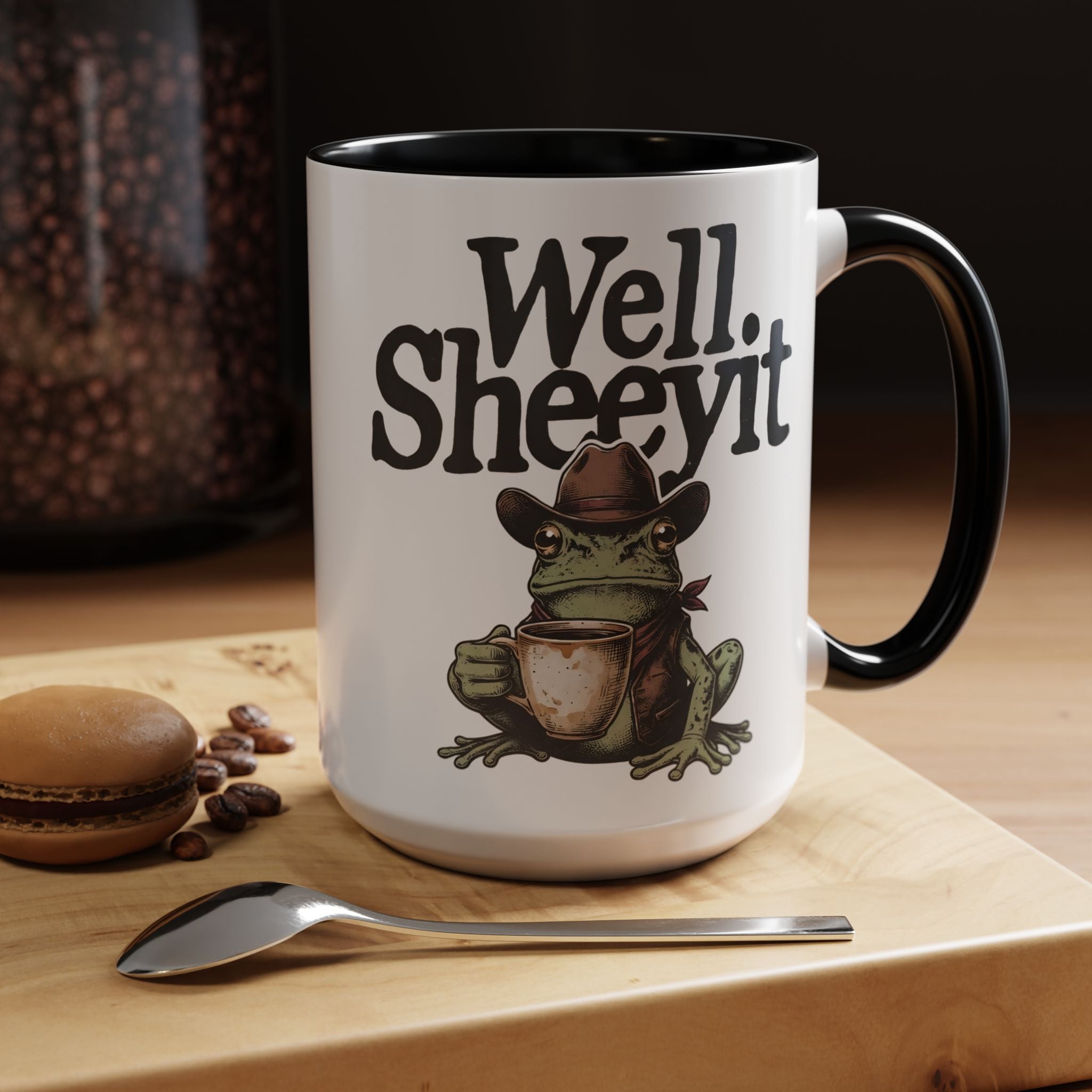 White ceramic mug featuring a cowboy frog holding a coffee cup with the text Well Sheeyit.